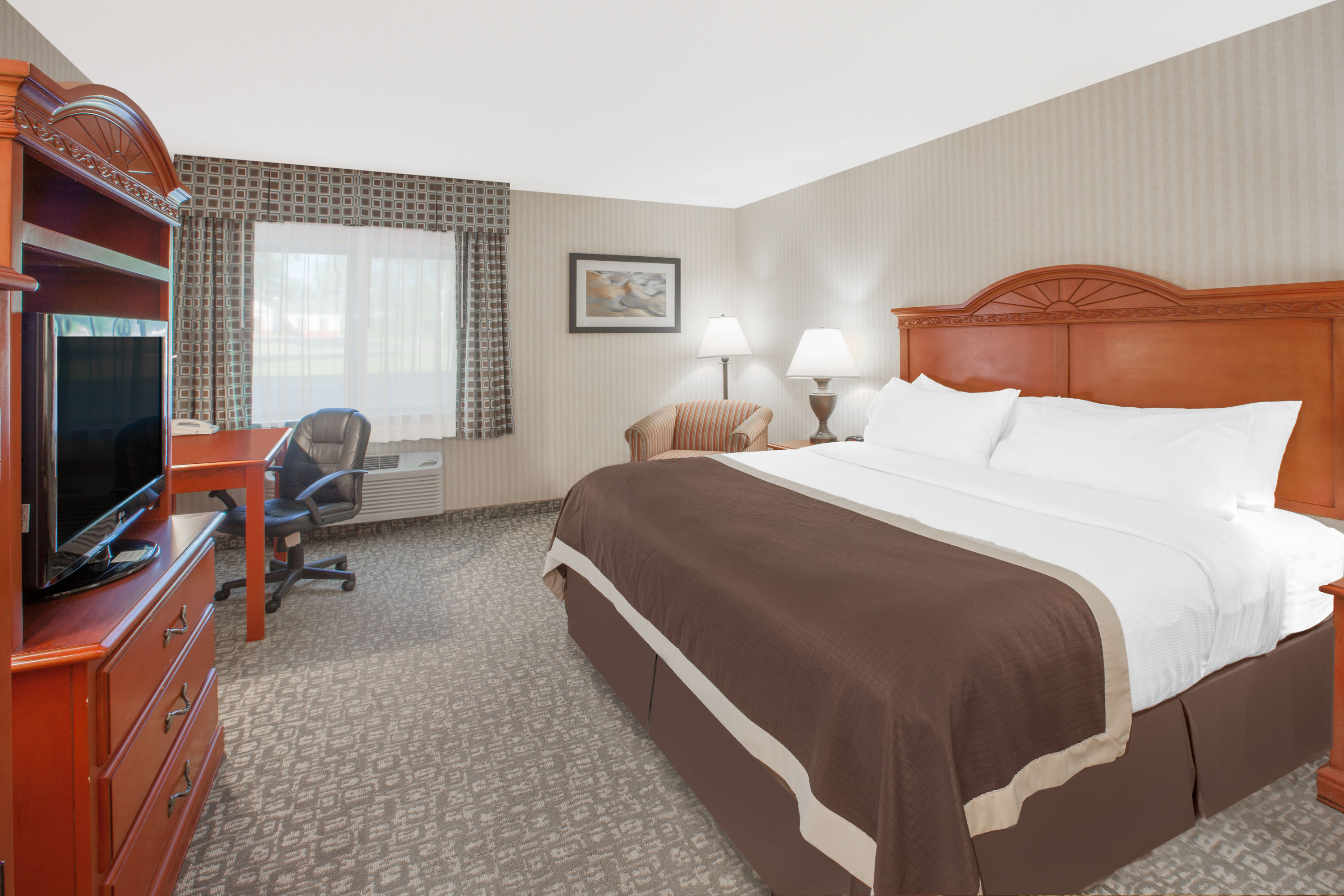 Guest room at the Baymont by Wyndham Jackson in Jackson, Michigan