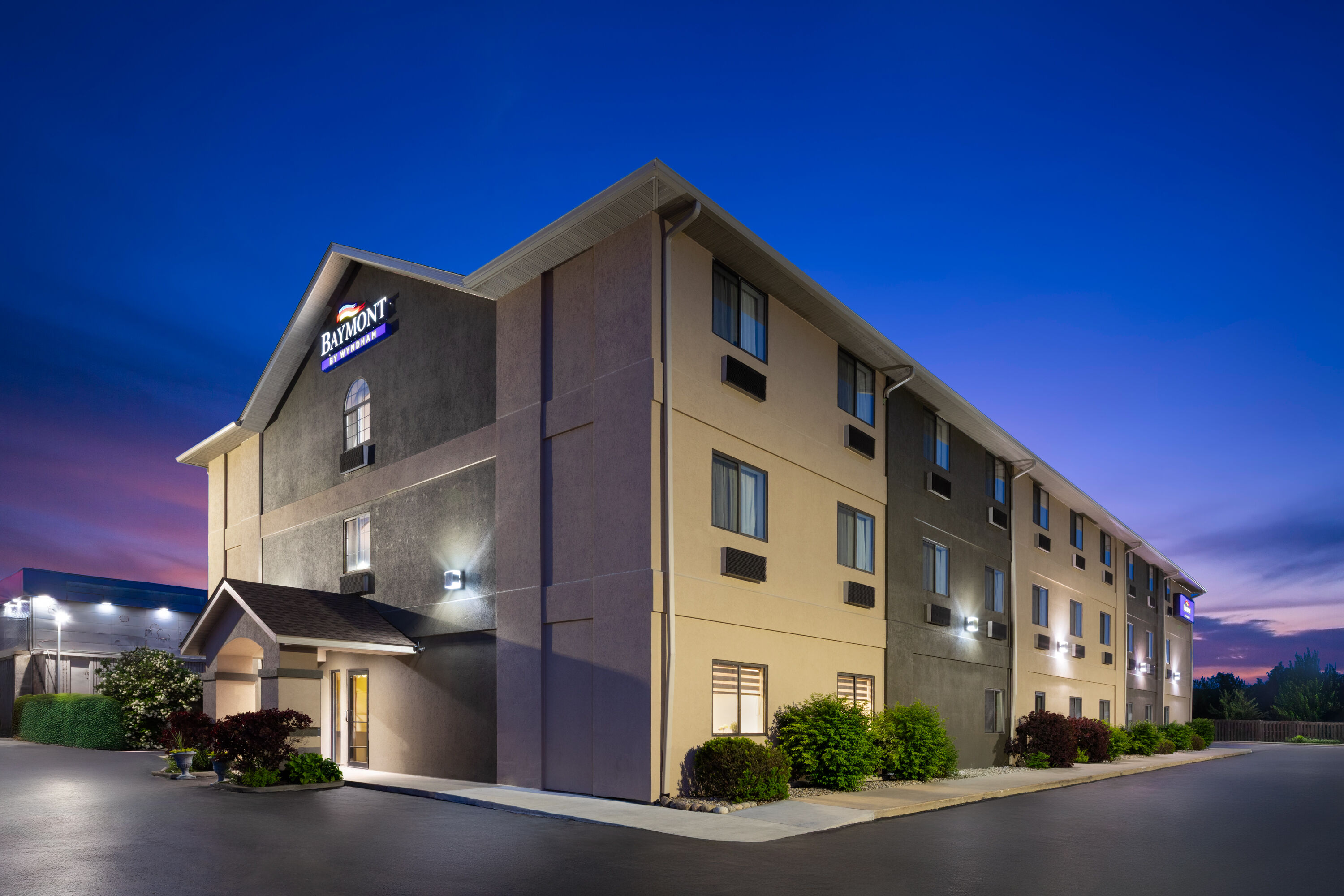 Exterior Dusk Image of Baymont by Wyndham Paw Paw hotel in Paw Paw, Michigan