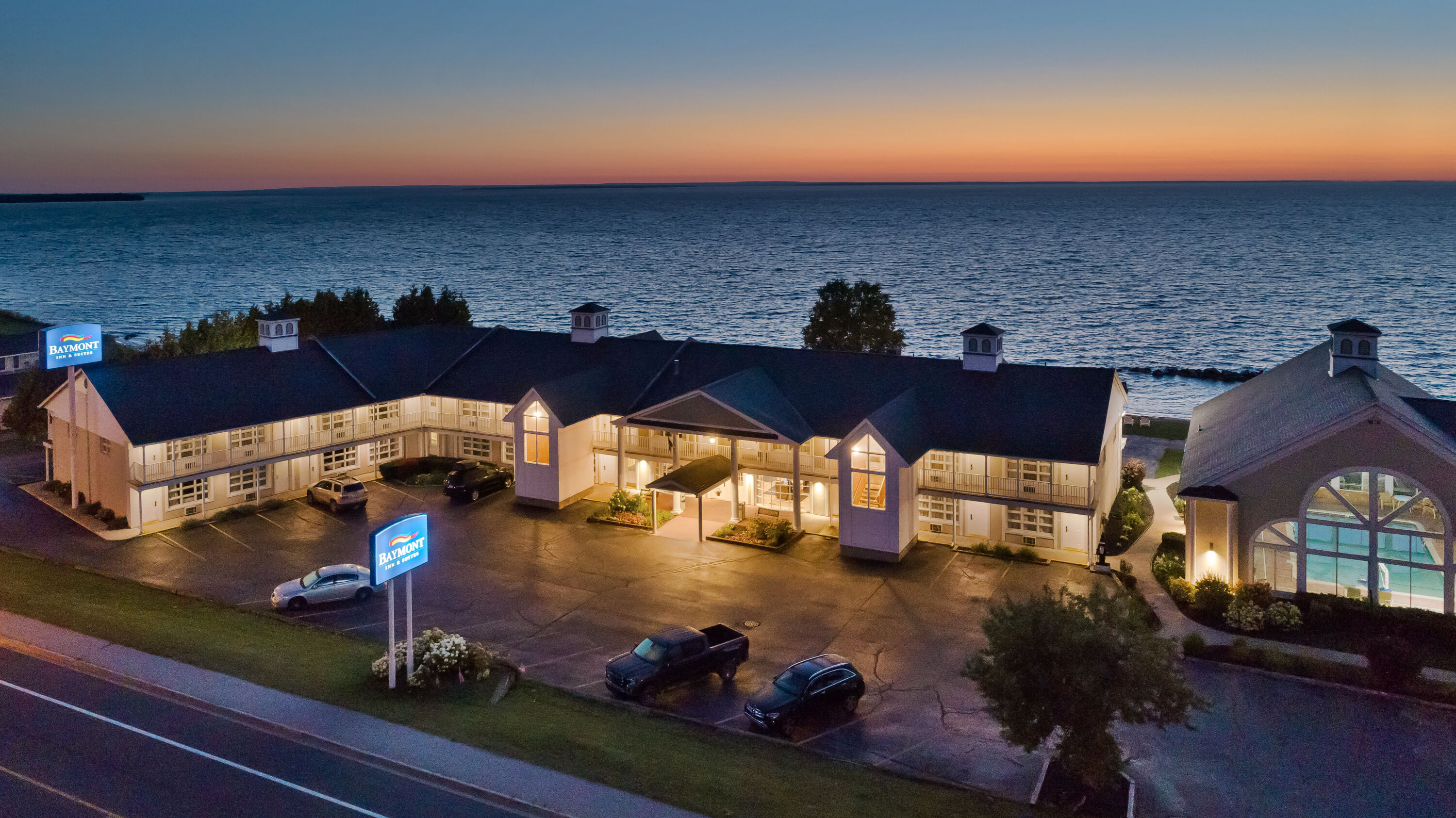 Exterior Dusk Image of Baymont by Wyndham St. Ignace Lakefront hotel in Saint Ignace, Michigan
