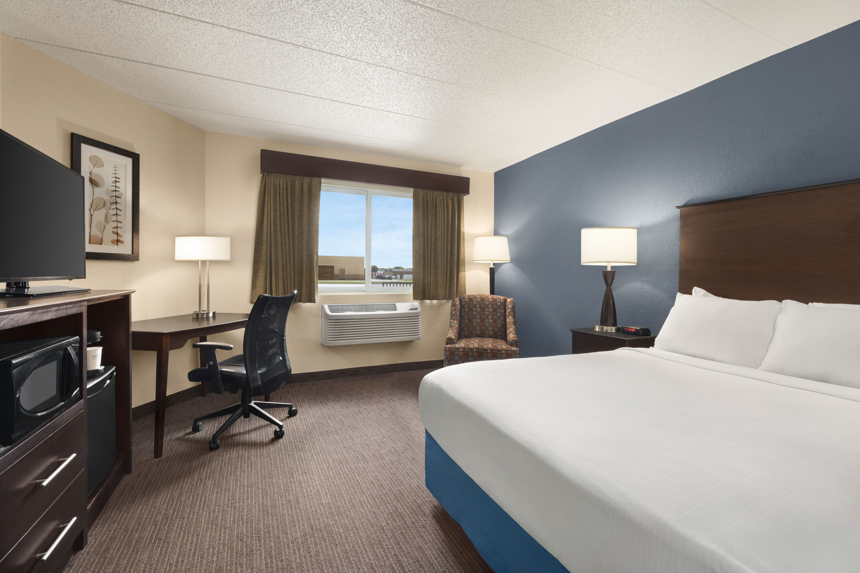 Guest room at the Baymont by Wyndham Owatonna in Owatonna, Minnesota