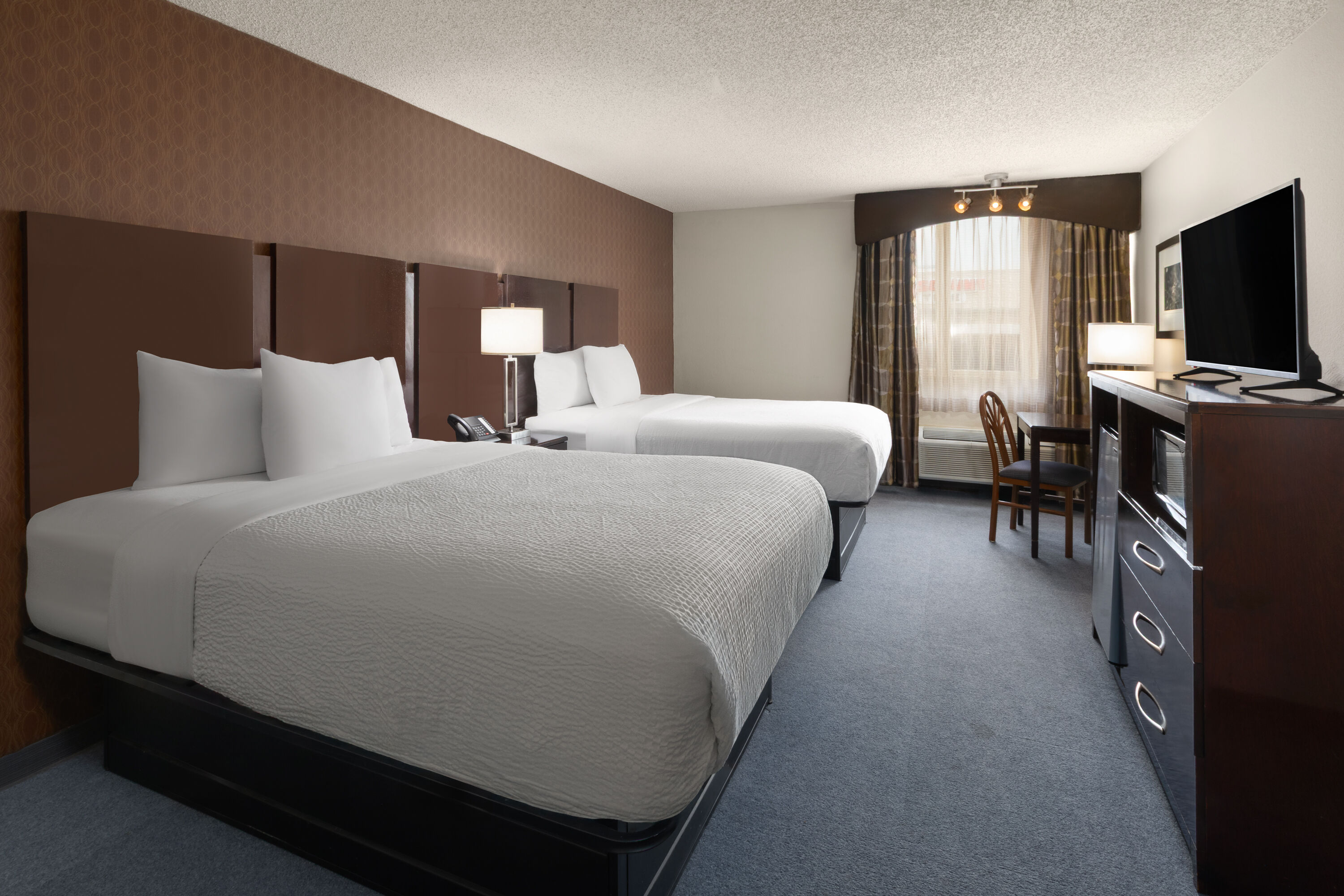 Guest room at the Baymont by Wyndham Festus in Festus, Missouri