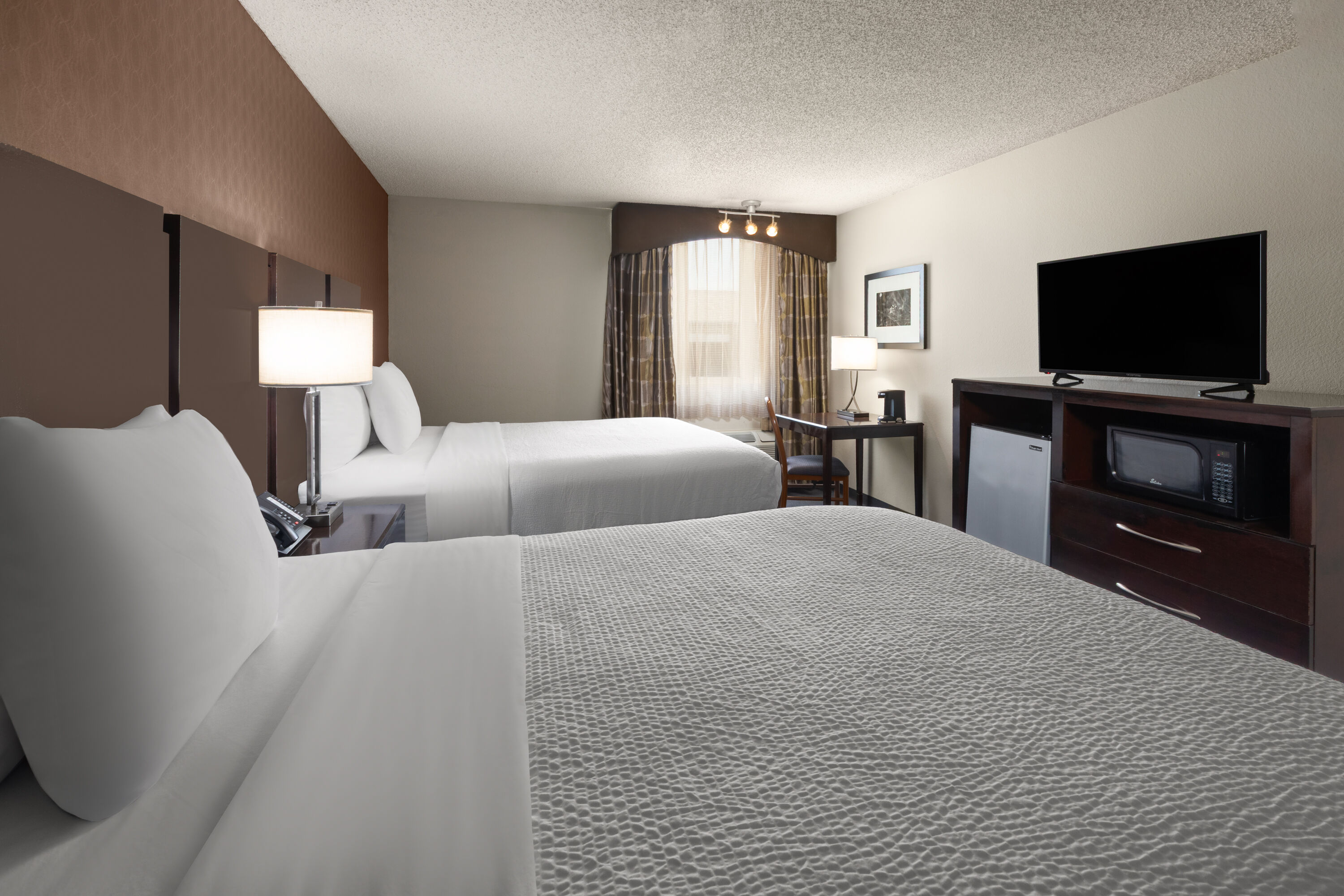 Guest room at the Baymont by Wyndham Festus in Festus, Missouri