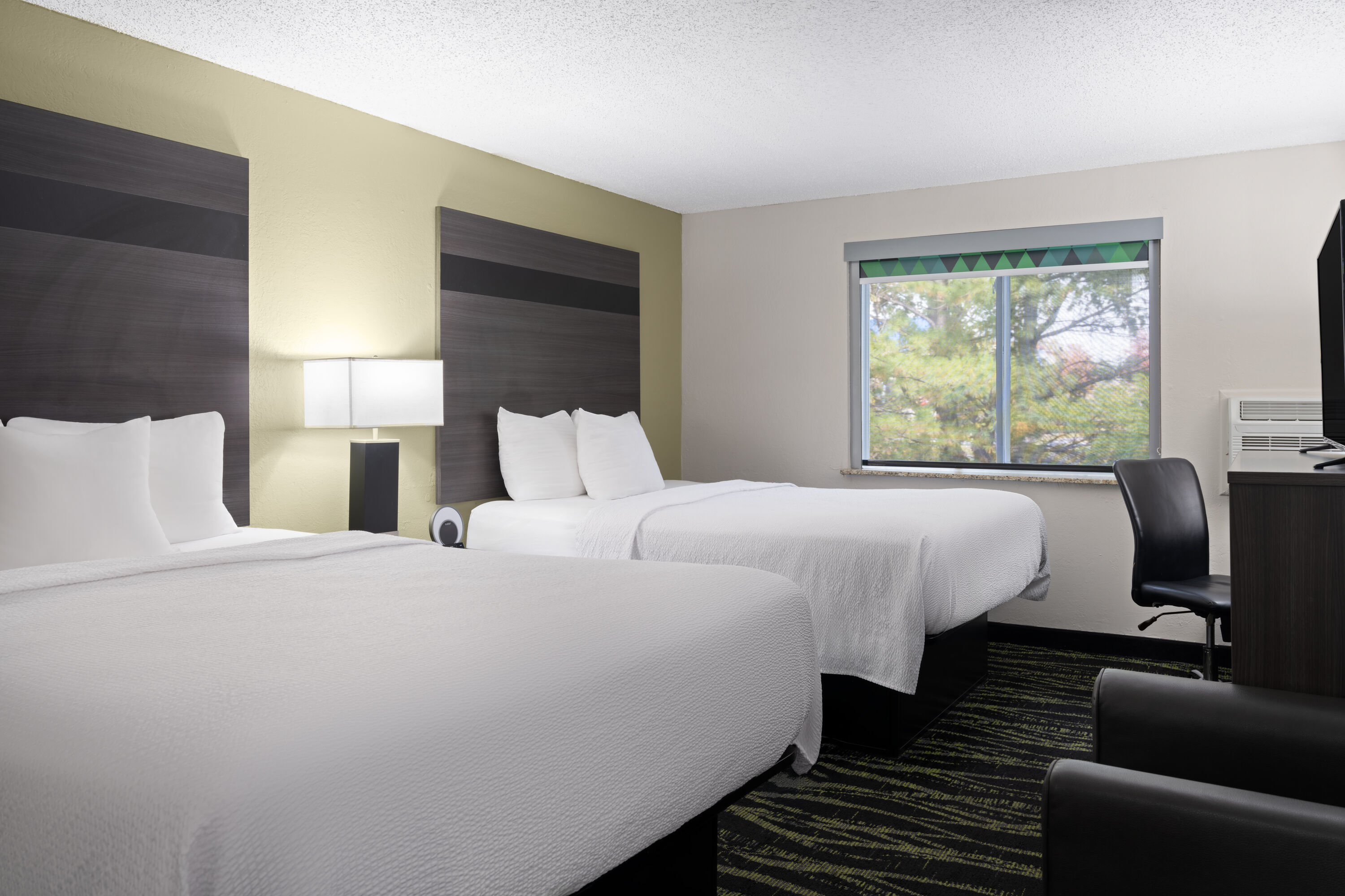 Guest room at the Baymont by Wyndham Liberty MO in Liberty, Missouri