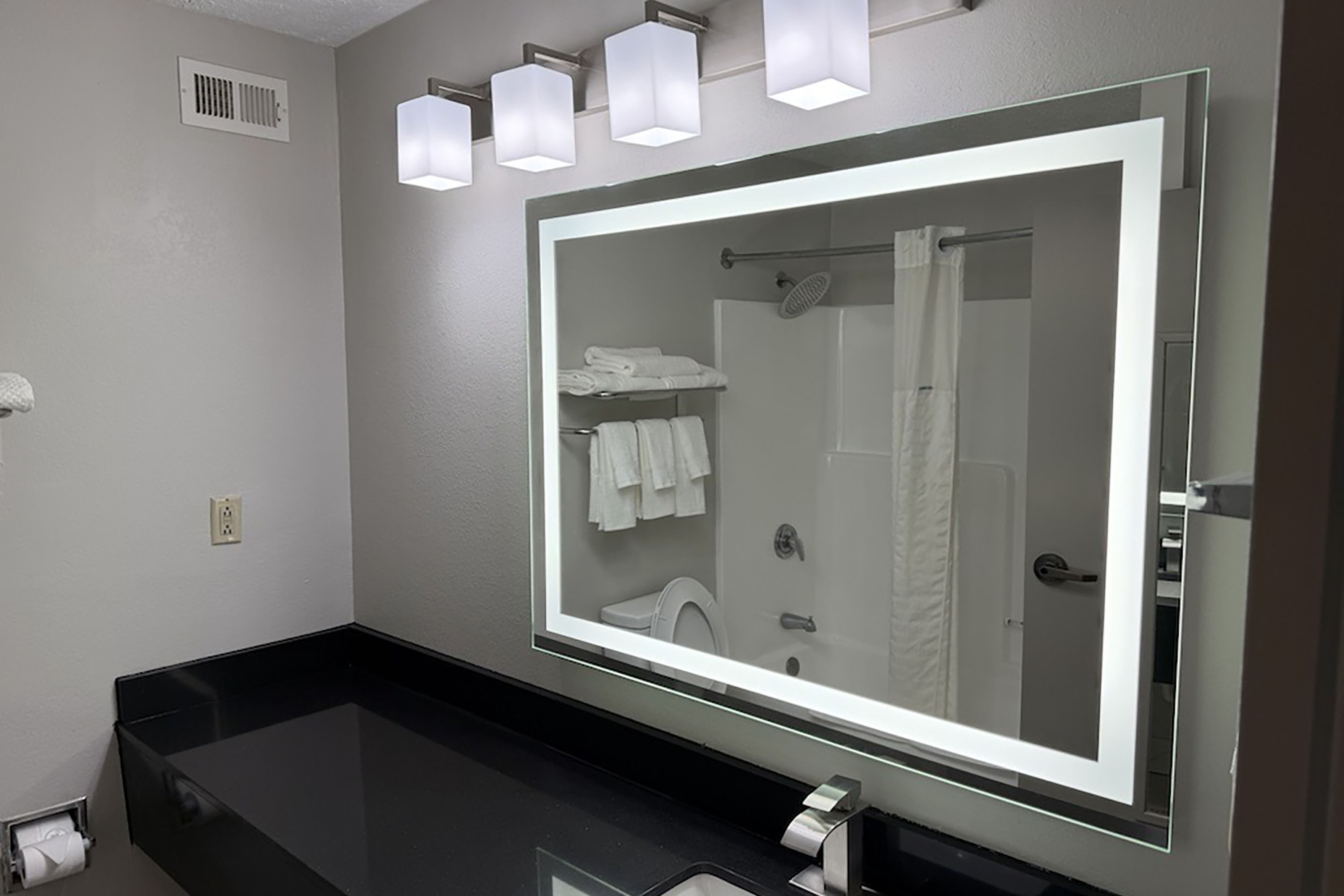 Guest room bath at the Baymont by Wyndham Philadelphia MS in Philadelphia, Mississippi