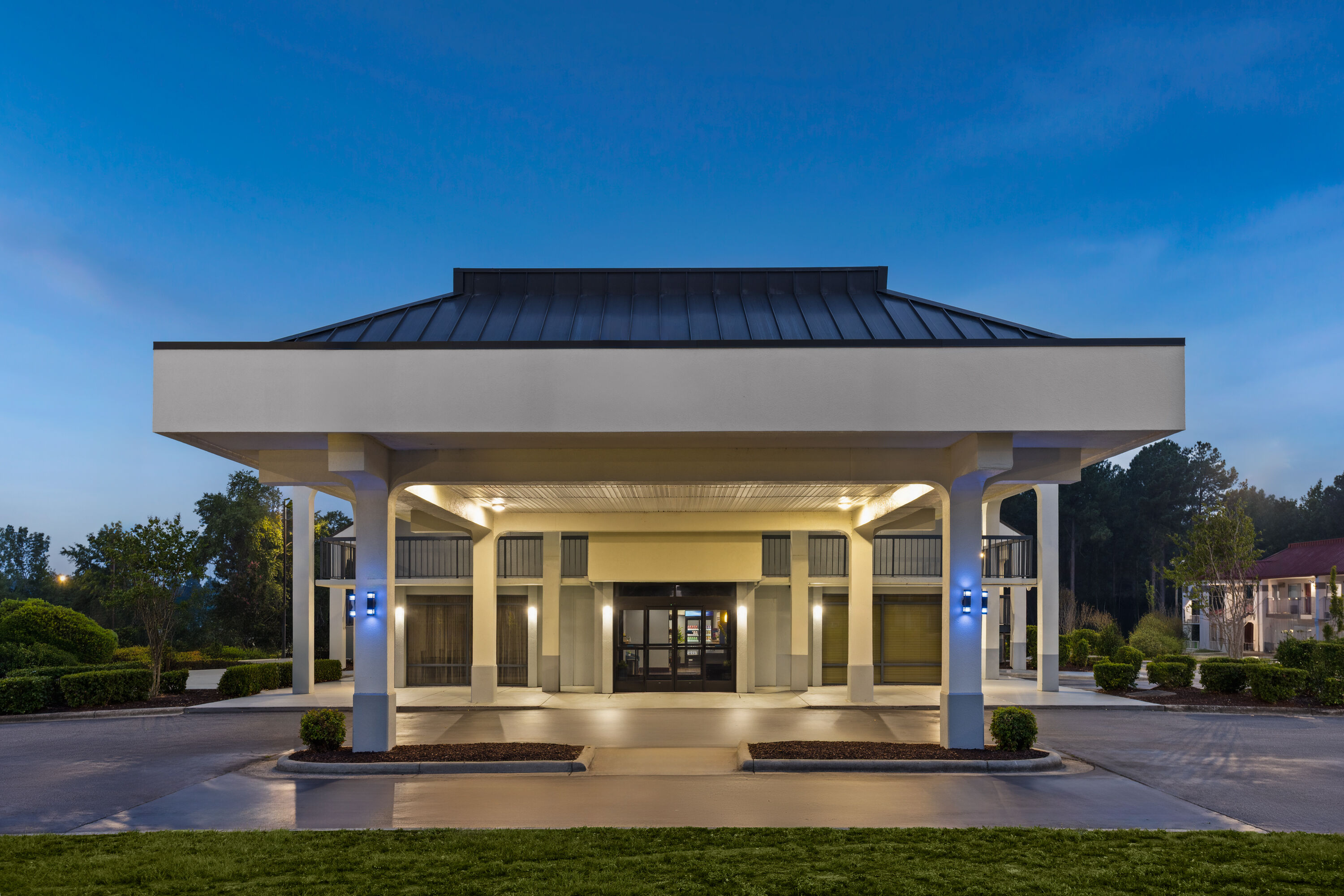 Exterior Dusk Image of Baymont by Wyndham Fayetteville NC hotel in Fayetteville, North Carolina