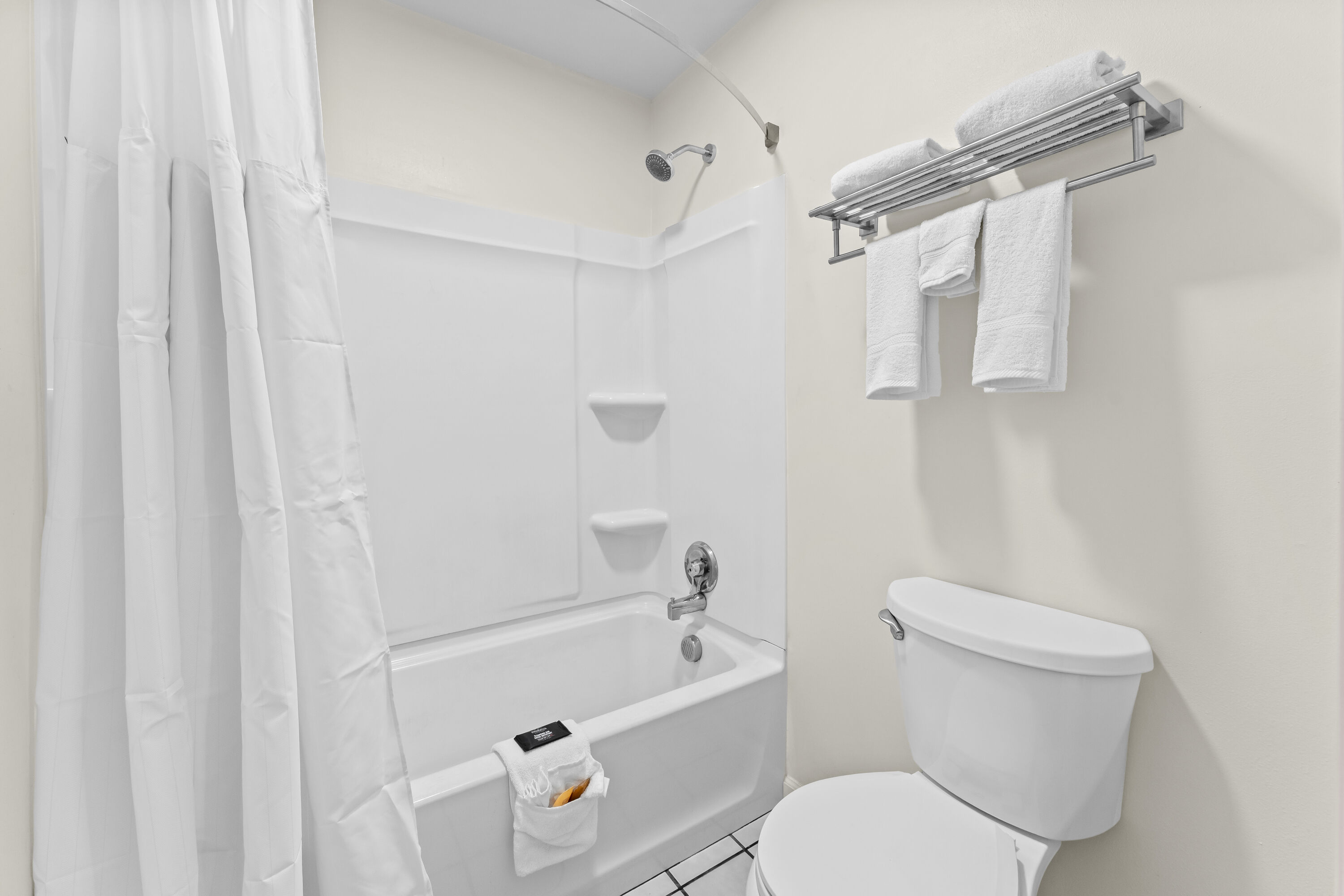 Guest room bath at the Baymont by Wyndham Sanford in Sanford, North Carolina