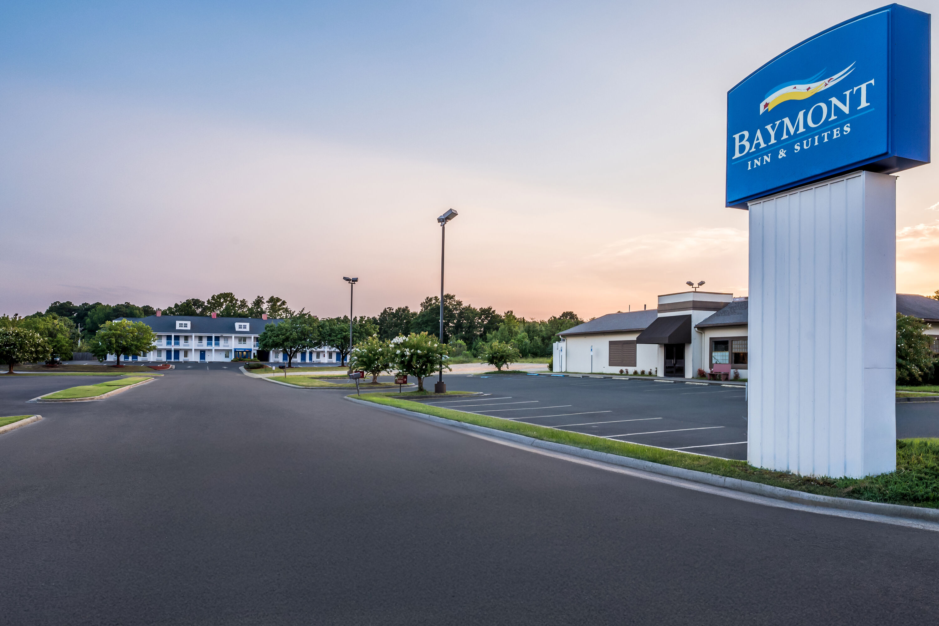 Exterior Night Image of Baymont by Wyndham Sanford hotel in Sanford, North Carolina