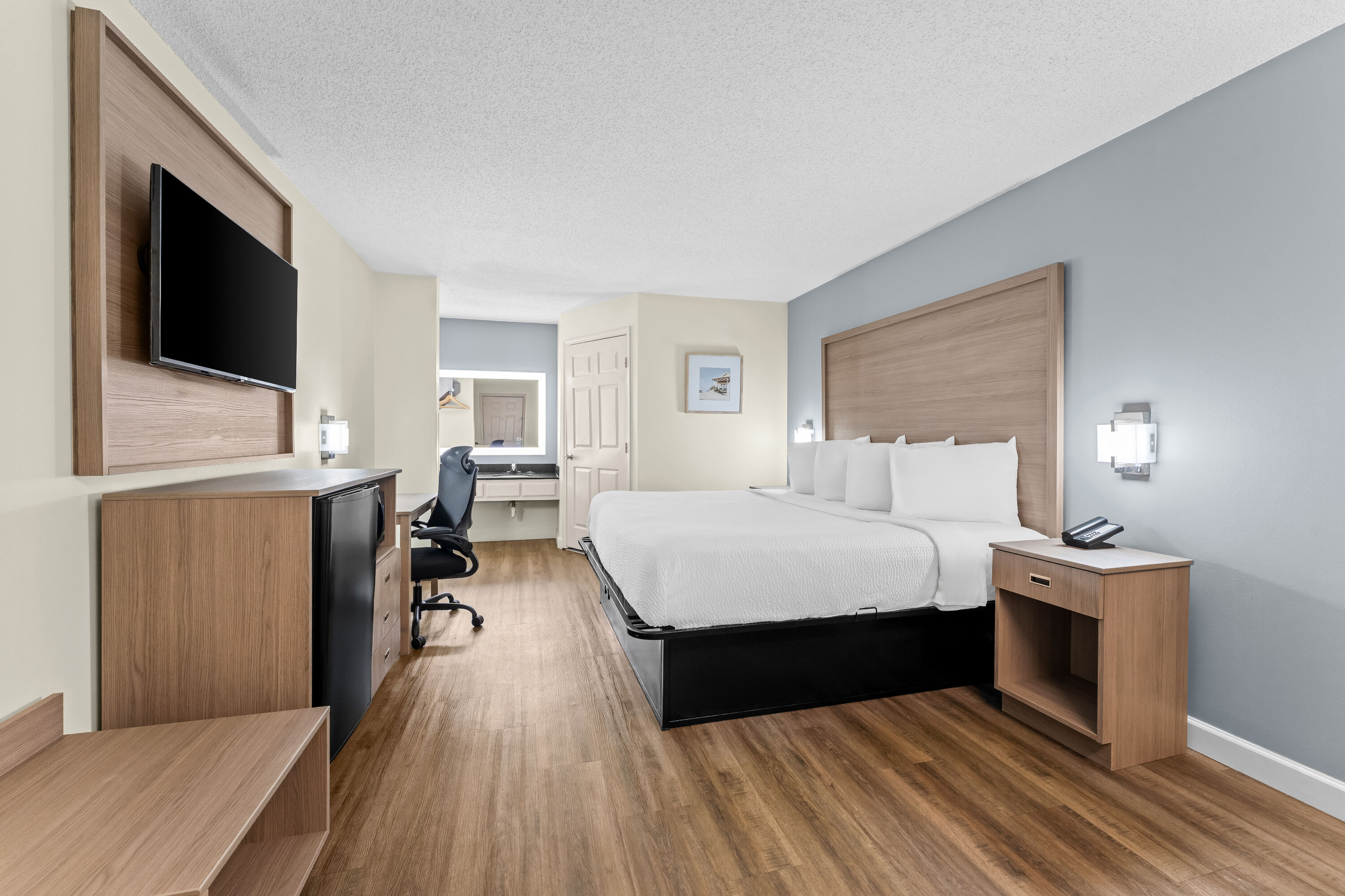 King bed guest room at the Baymont by Wyndham Sanford in Sanford, North Carolina