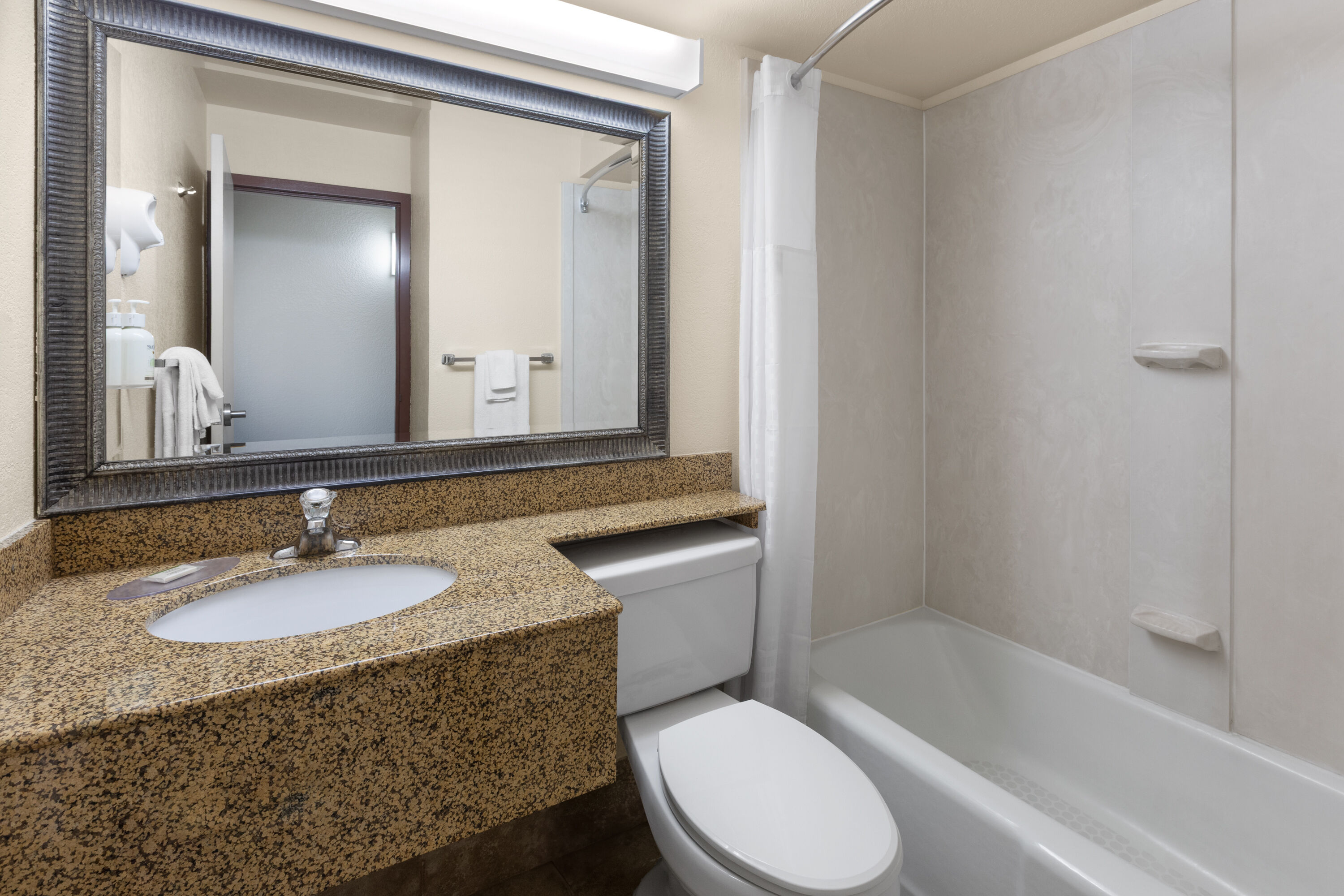 Guest room bath at the Baymont by Wyndham Jamestown Conference Center & Water Park in Jamestown, North Dakota