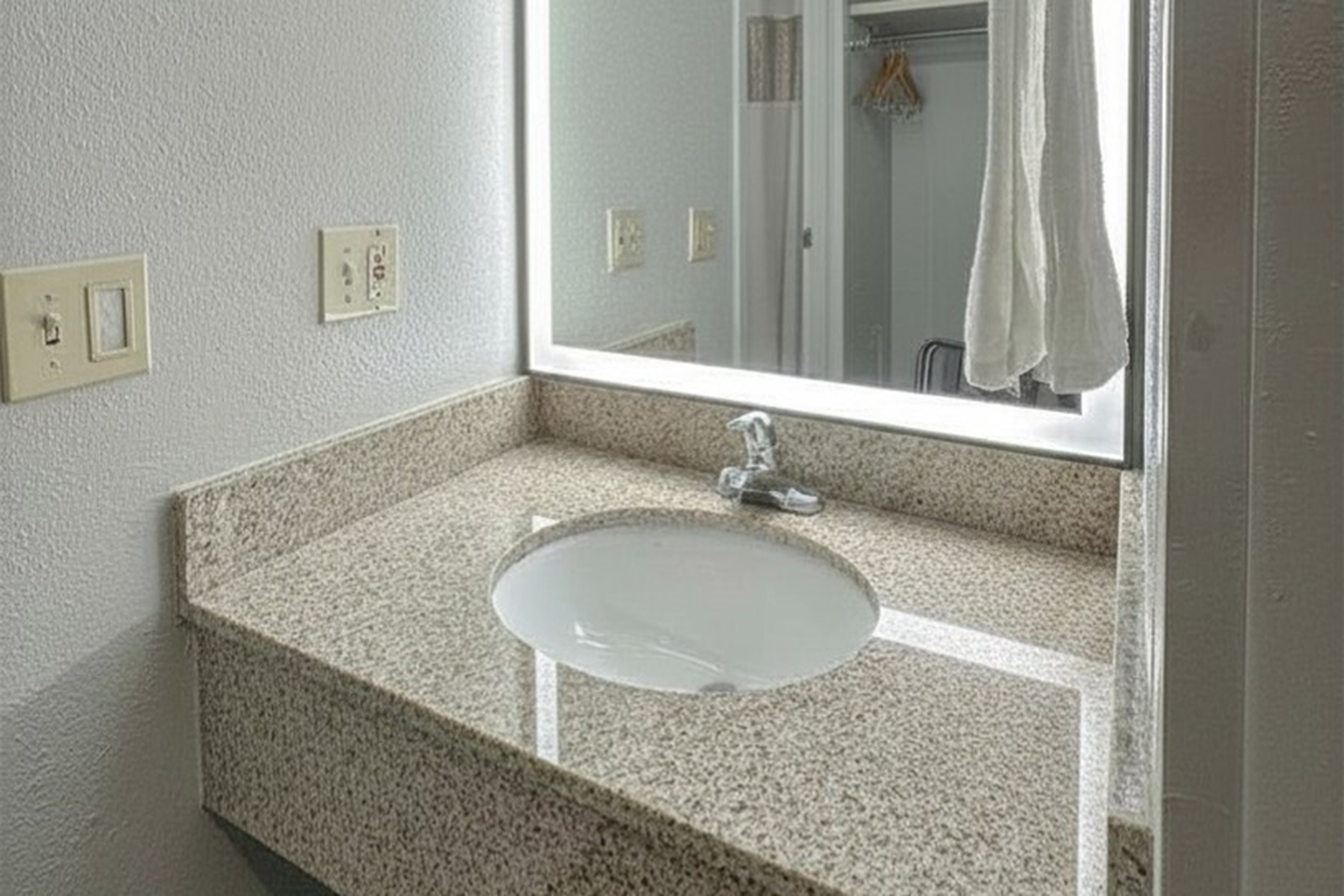 Guest room bath at the Baymont by Wyndham Queensbury Lake George in Queensbury, New York