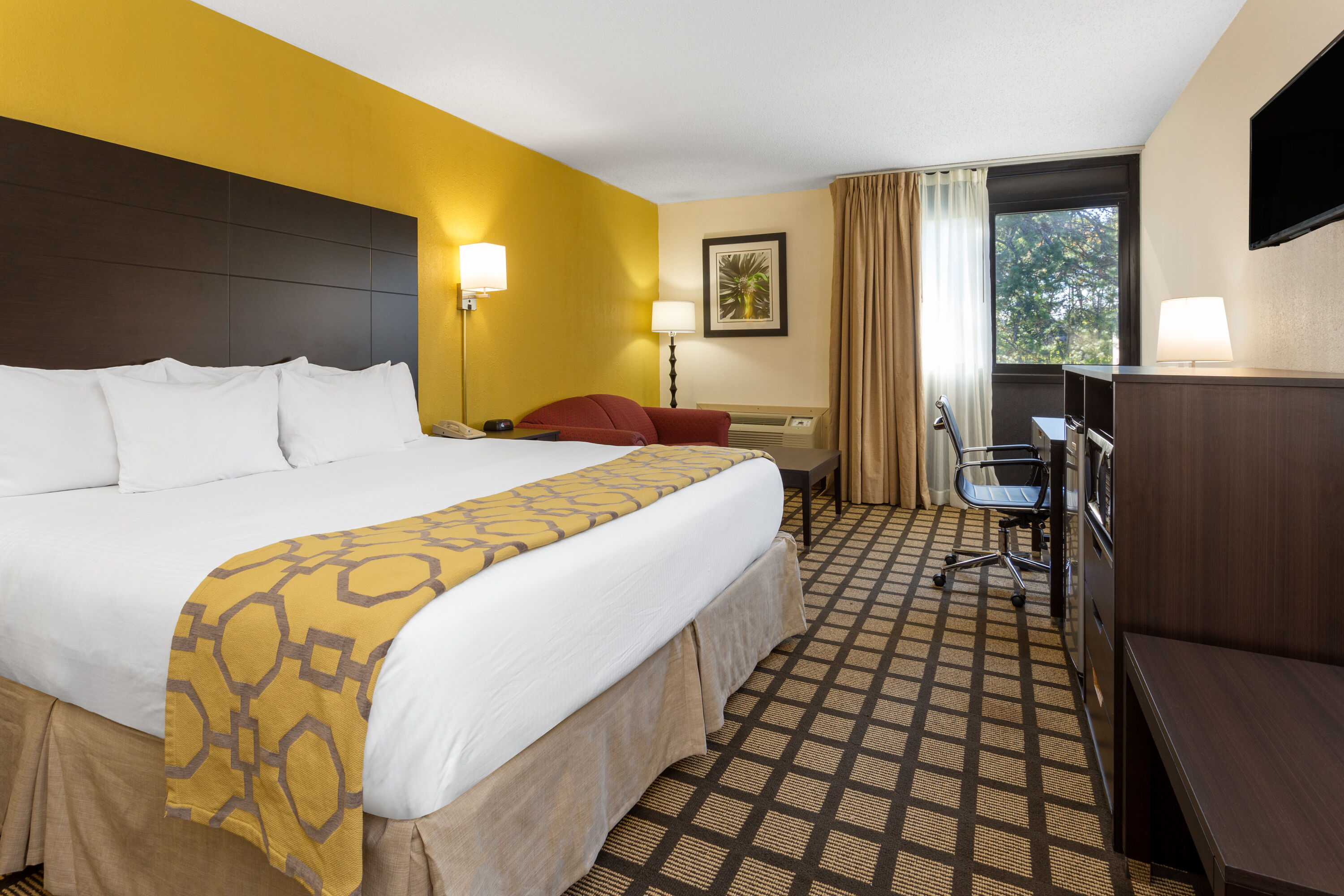 Guest room at the Baymont by Wyndham Queensbury Lake George in Queensbury, New York