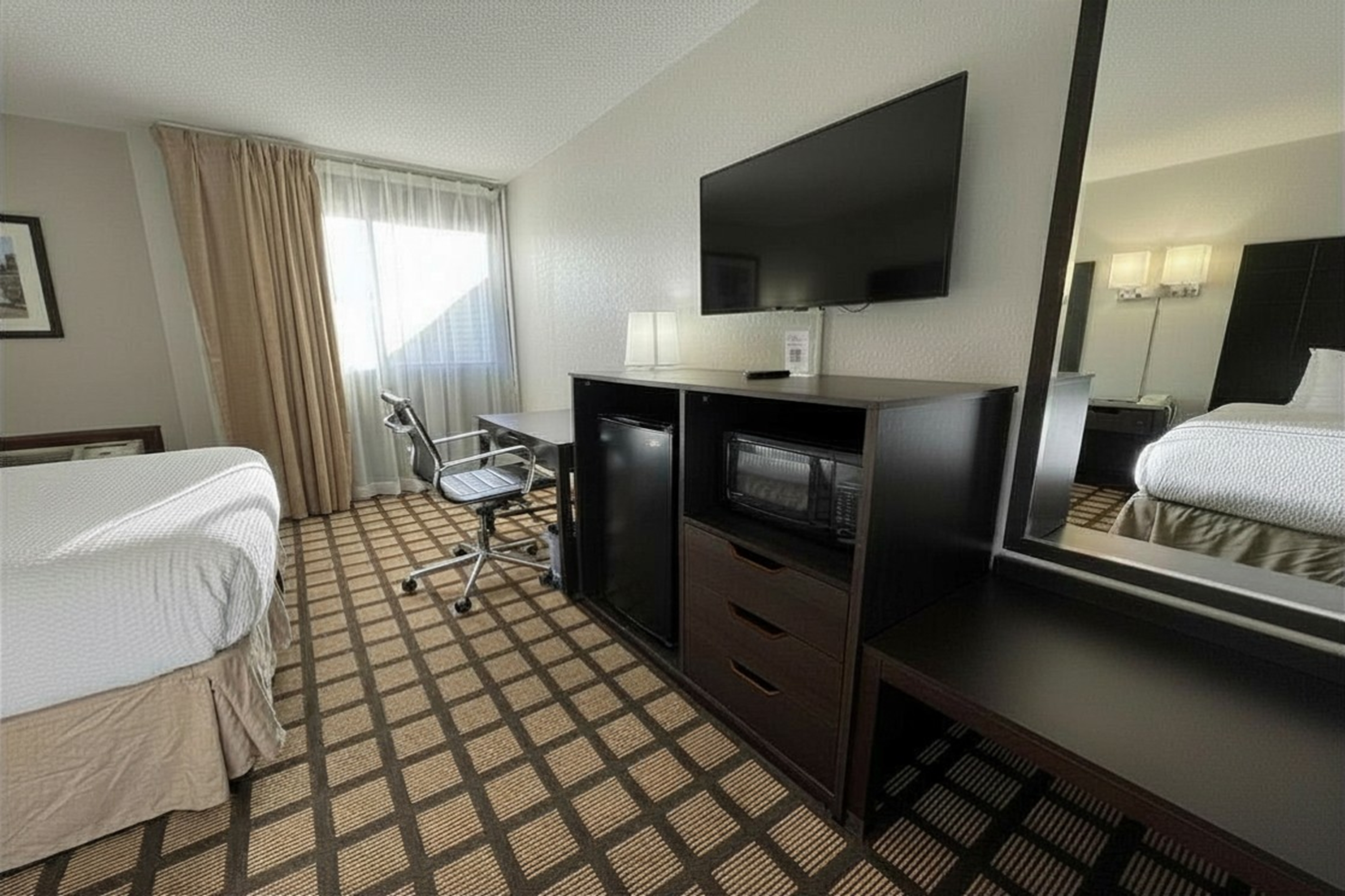 Guest room at the Baymont by Wyndham Queensbury Lake George in Queensbury, New York