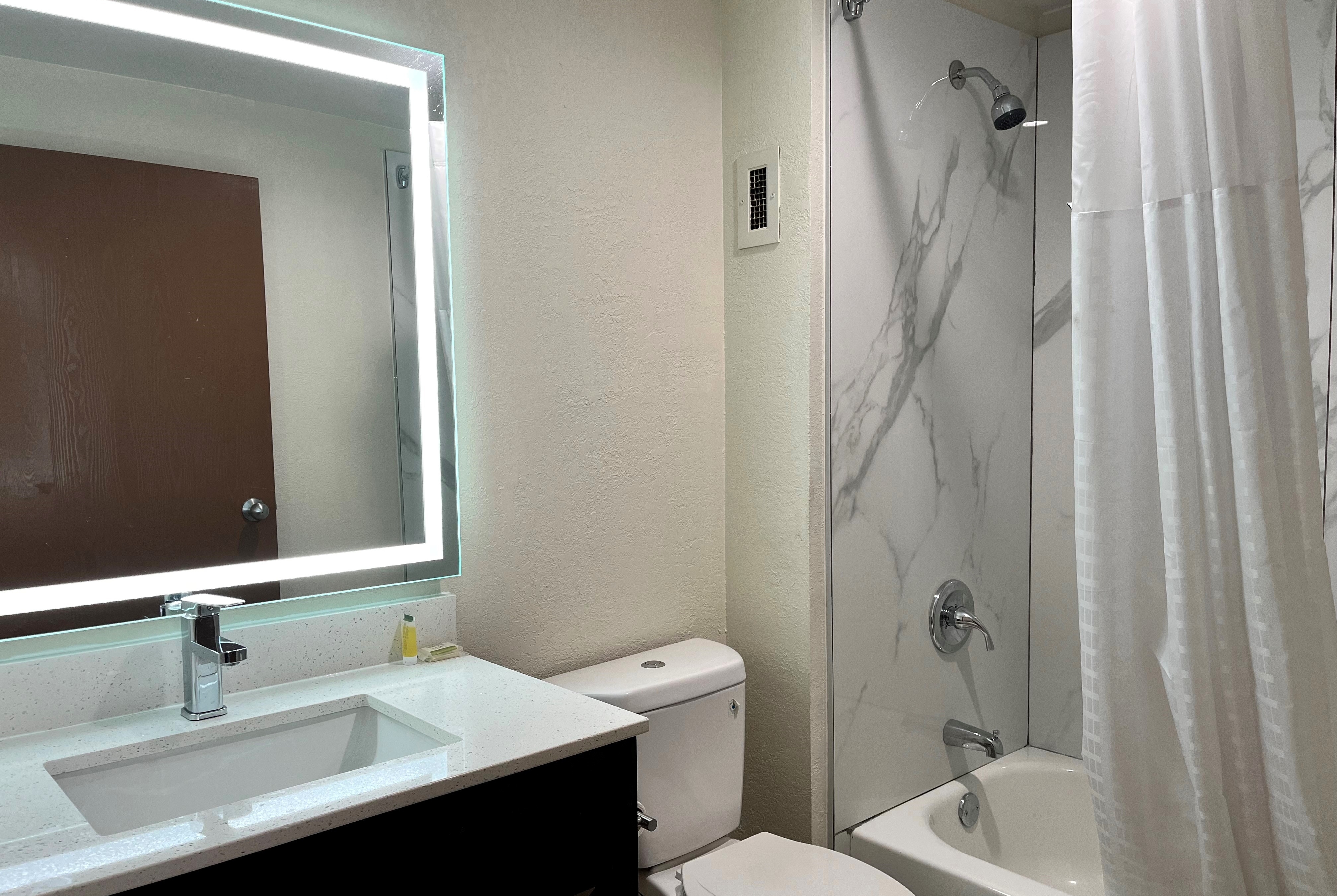 Guest room bath at the Baymont by Wyndham Cincinnati in Cincinnati, Ohio