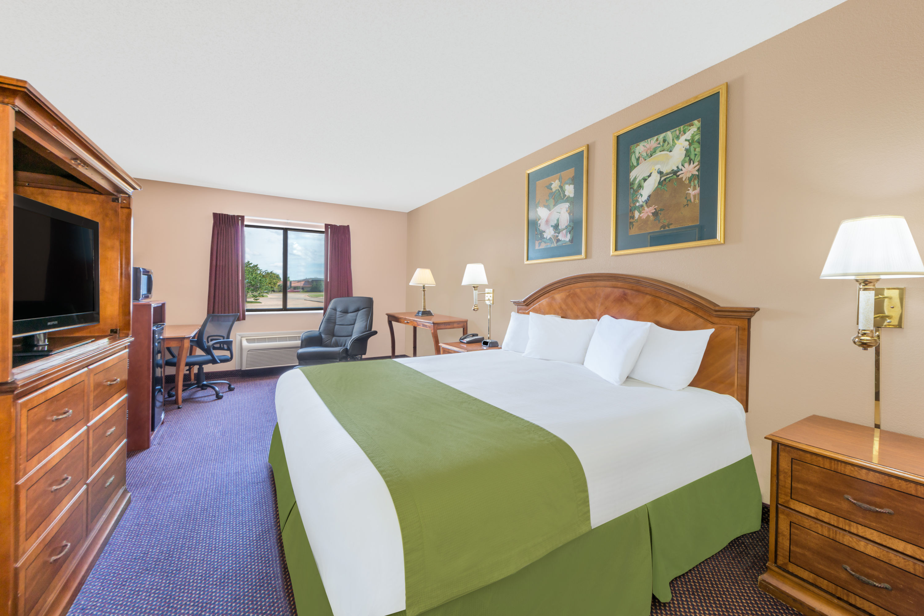 Guest room at the Baymont by Wyndham Enid in Enid, Oklahoma