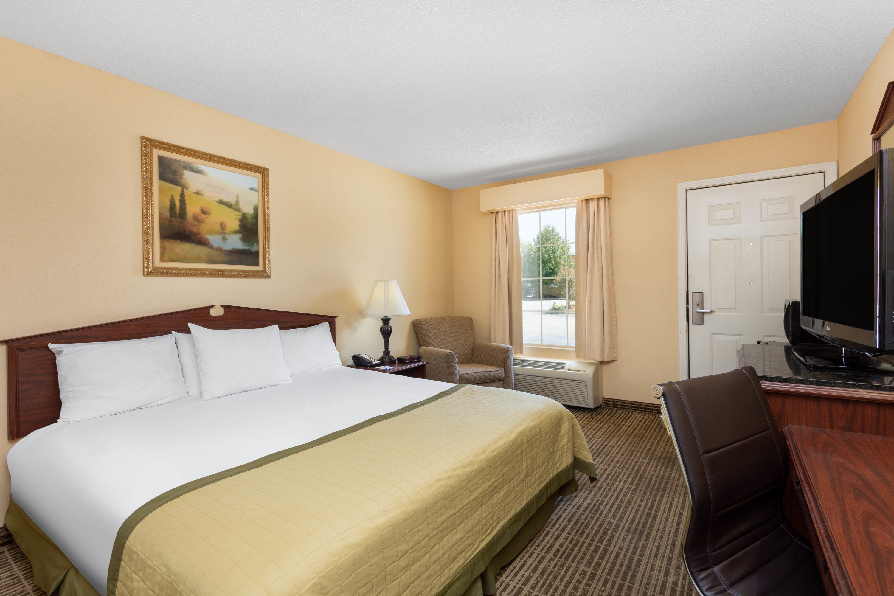 Guest room at the Baymont by Wyndham Easley/Greenville in Easley, South Carolina