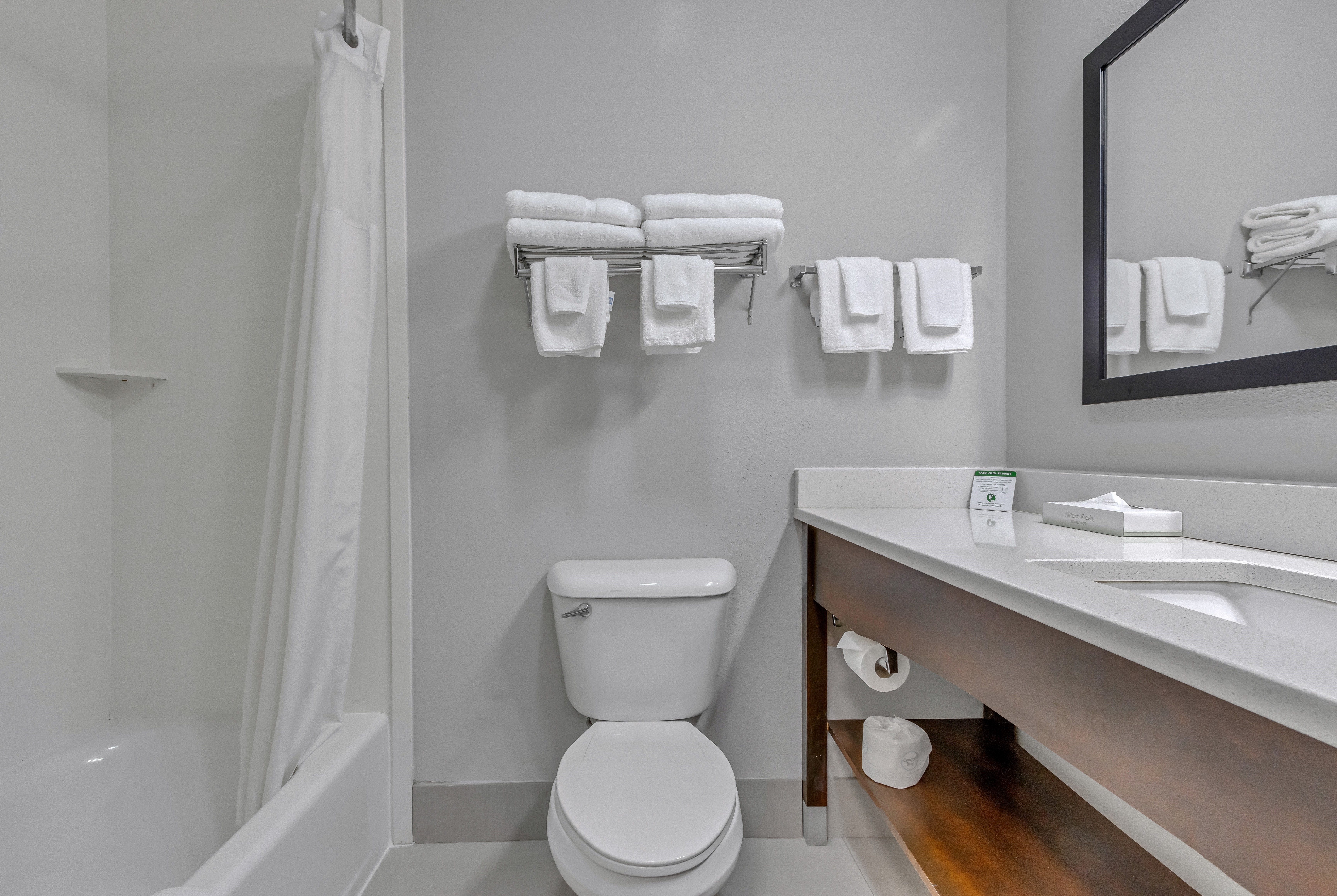 Guest room bath at the Baymont by Wyndham North Myrtle Beach in North Myrtle Beach, South Carolina