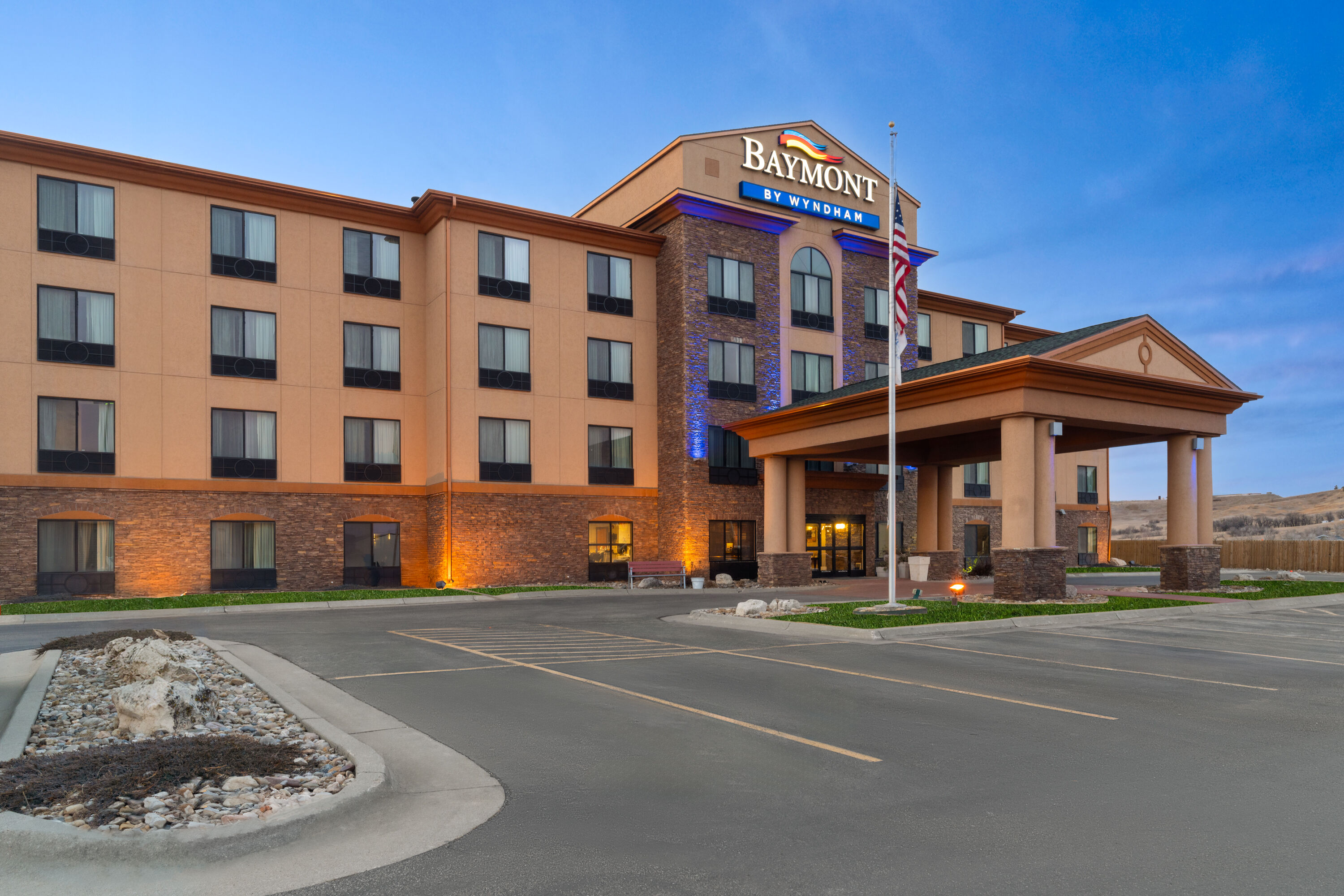 Exterior Dusk Image of Baymont Inn & Suites by Wyndham Sturgis hotel in Sturgis, South Dakota