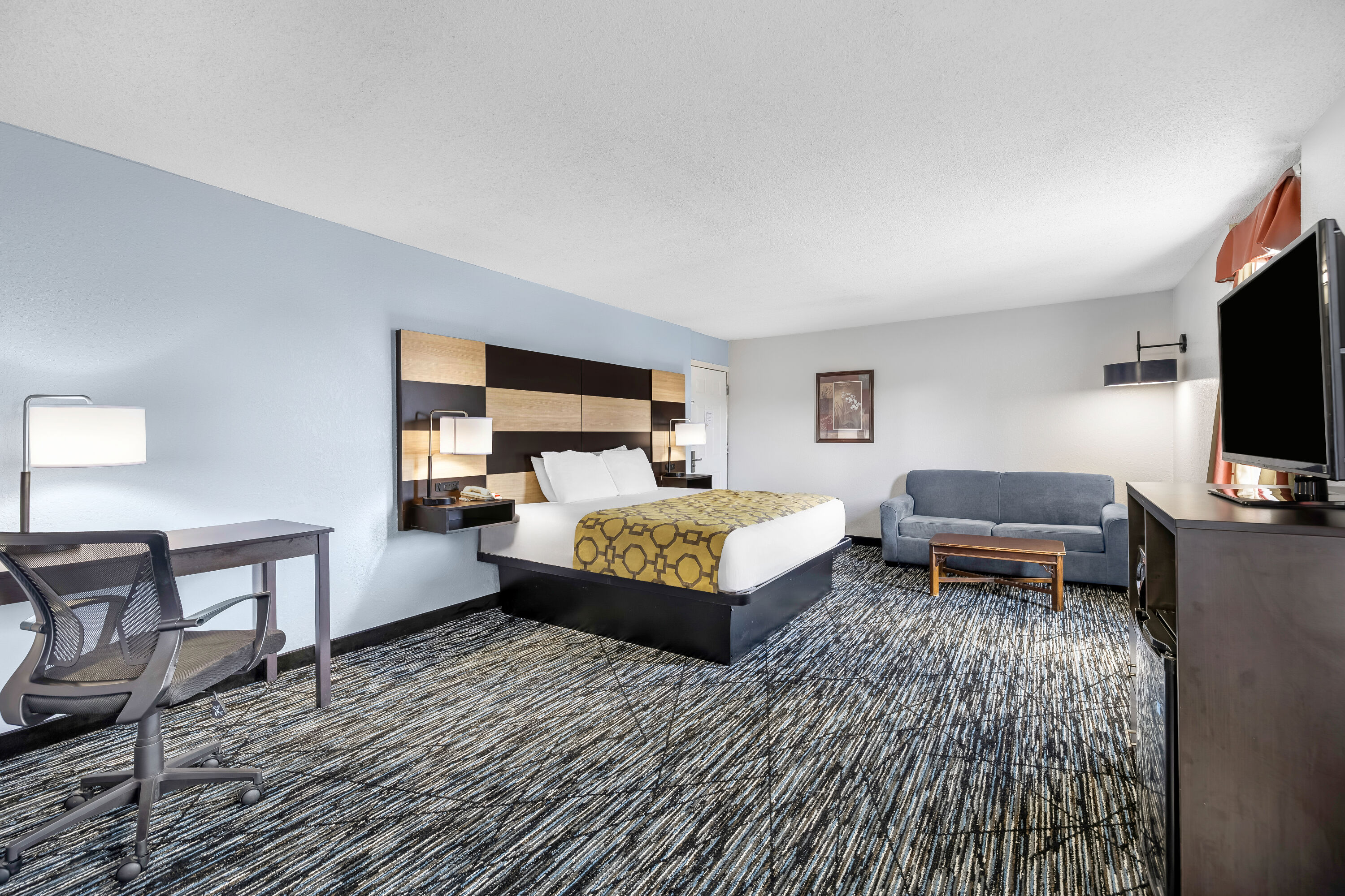 King bed guest room at the Baymont by Wyndham Sevierville Pigeon Forge in Sevierville, Tennessee
