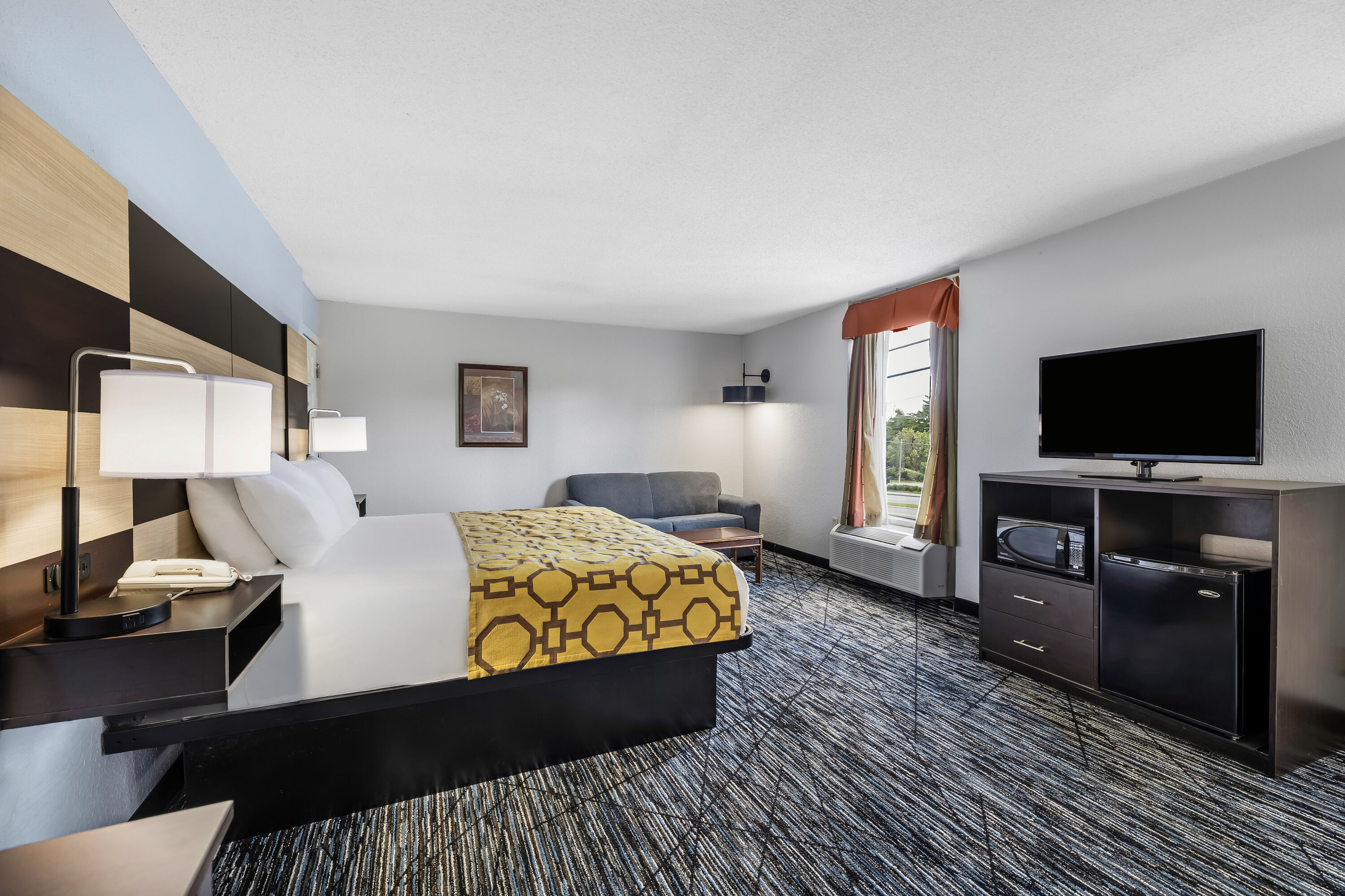 King bed guest room at the Baymont by Wyndham Sevierville Pigeon Forge in Sevierville, Tennessee