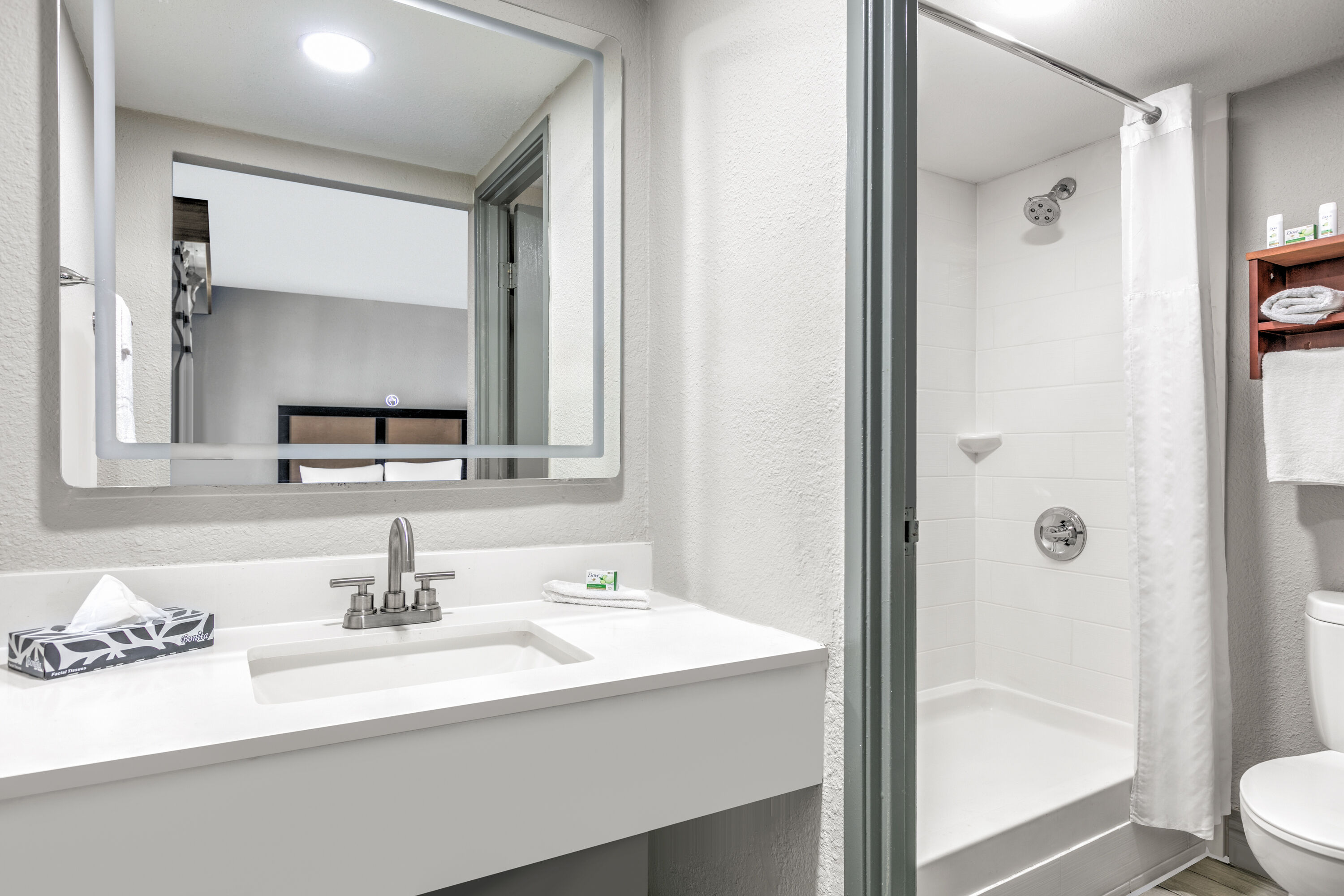 Guest room bath at the Baymont by Wyndham Austin University Area in Austin, Texas