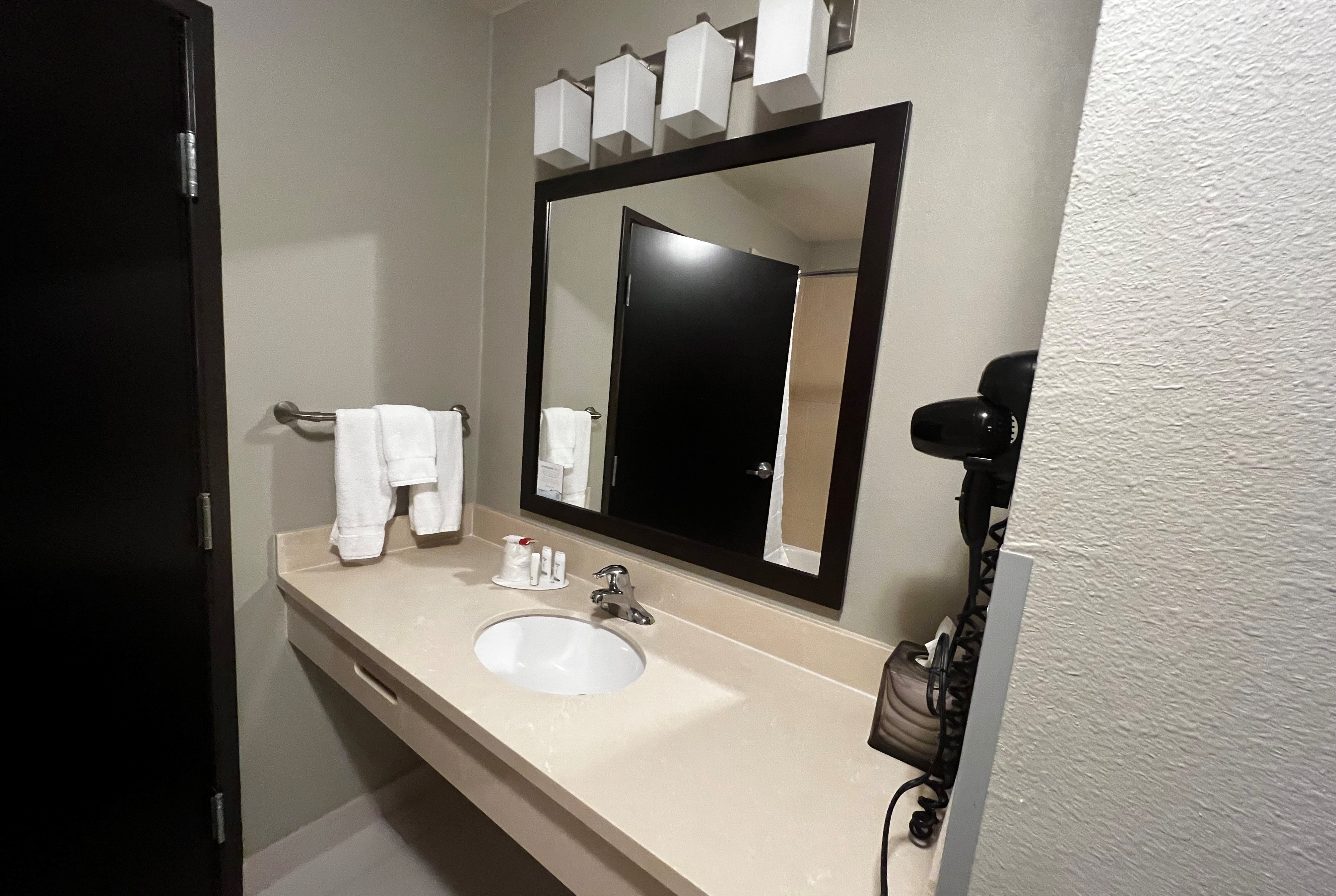 Guest room bath at the Baymont by Wyndham College Station in College Station, Texas