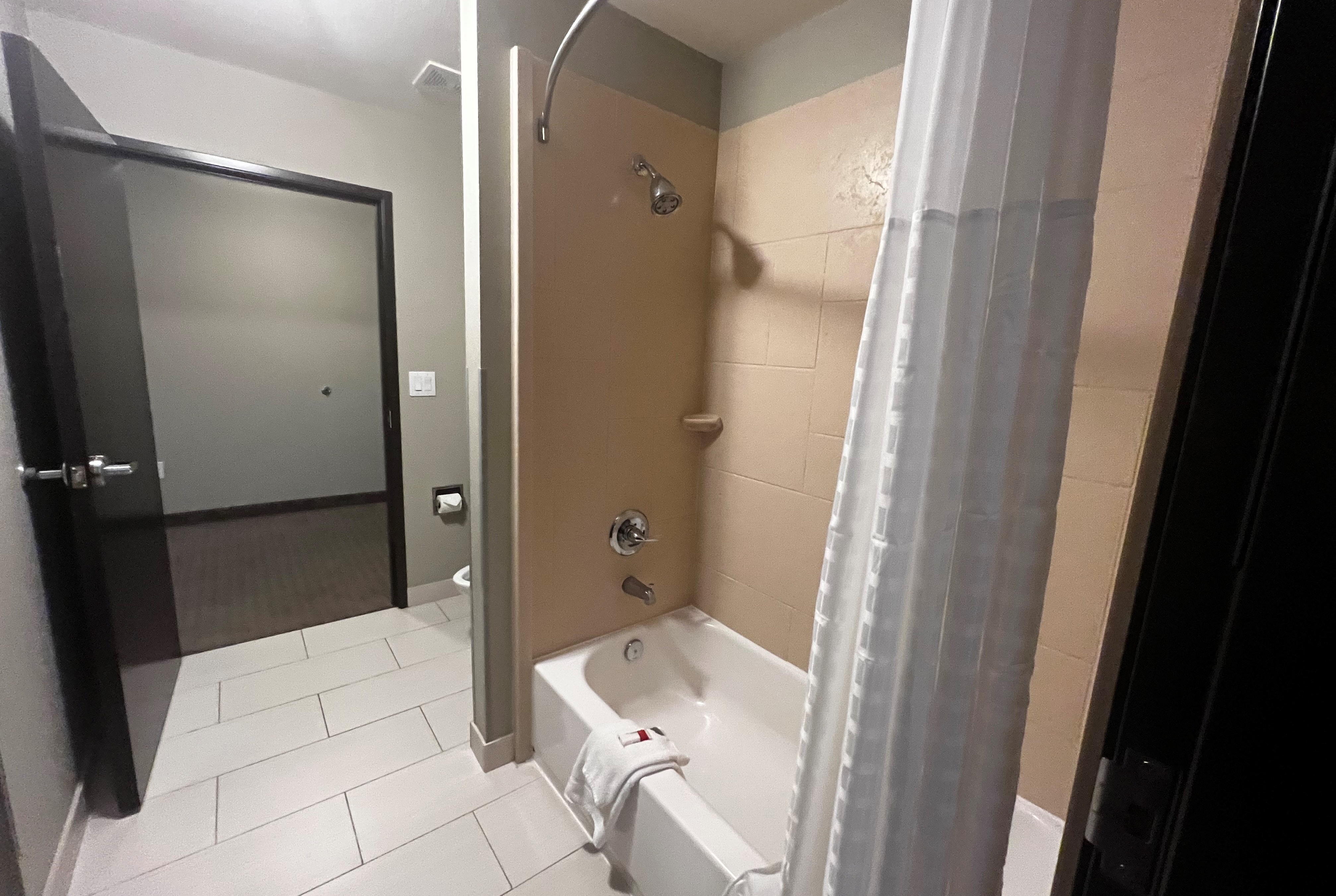 Guest room bath at the Baymont by Wyndham College Station in College Station, Texas