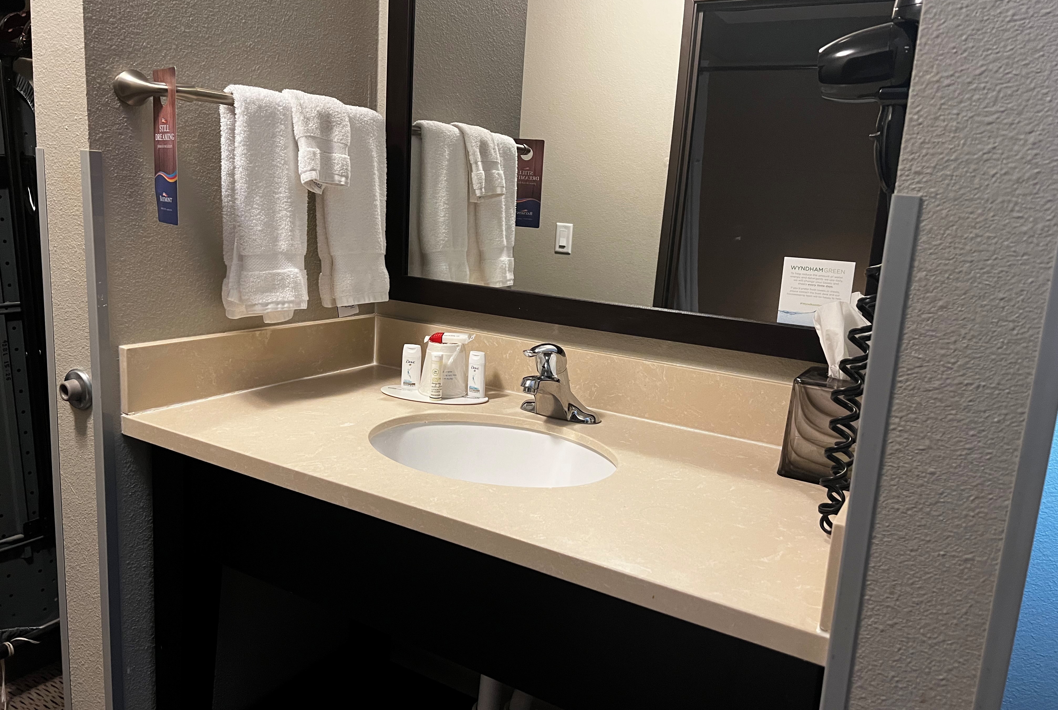 Guest room bath at the Baymont by Wyndham College Station in College Station, Texas