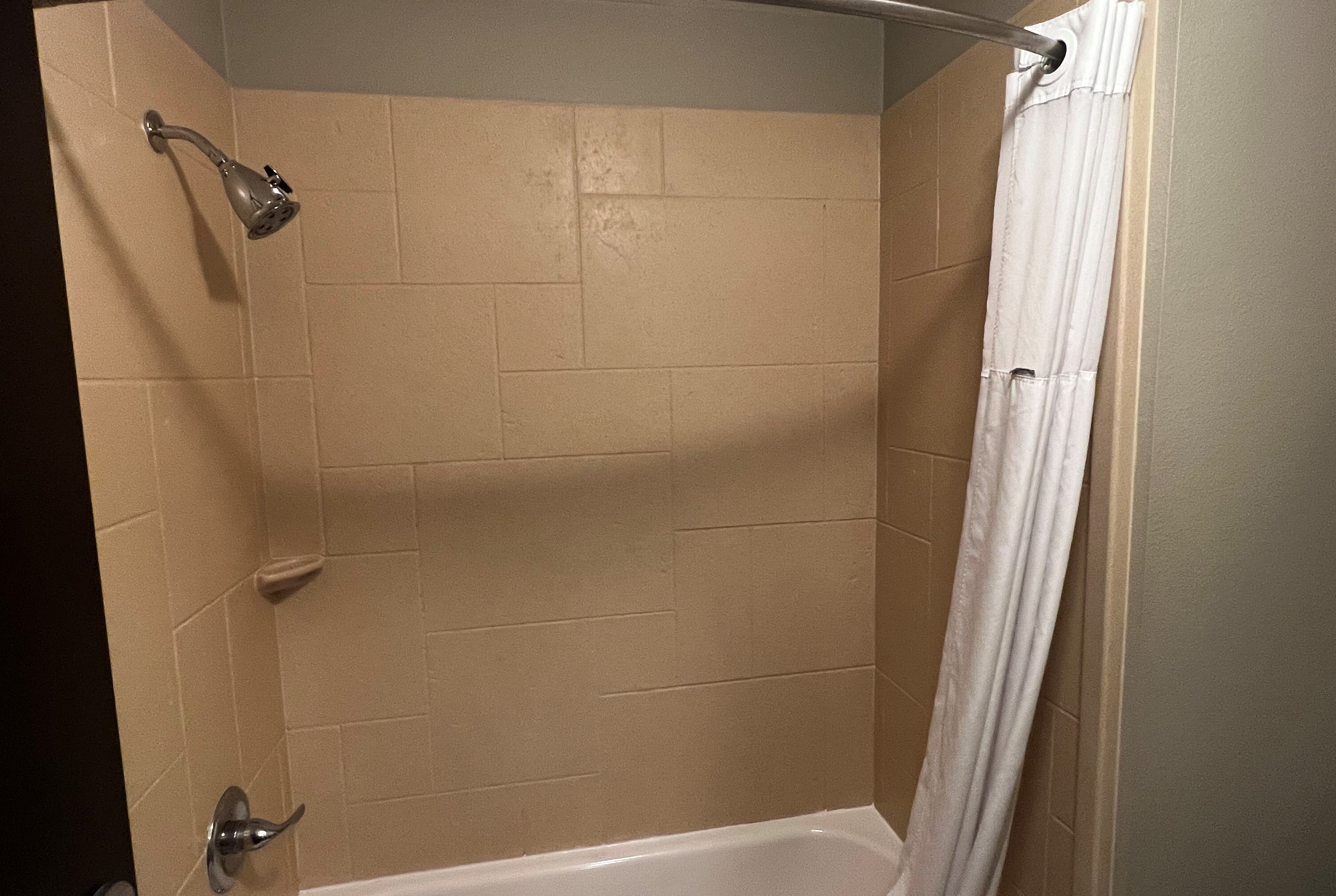 Guest room bath at the Baymont by Wyndham College Station in College Station, Texas