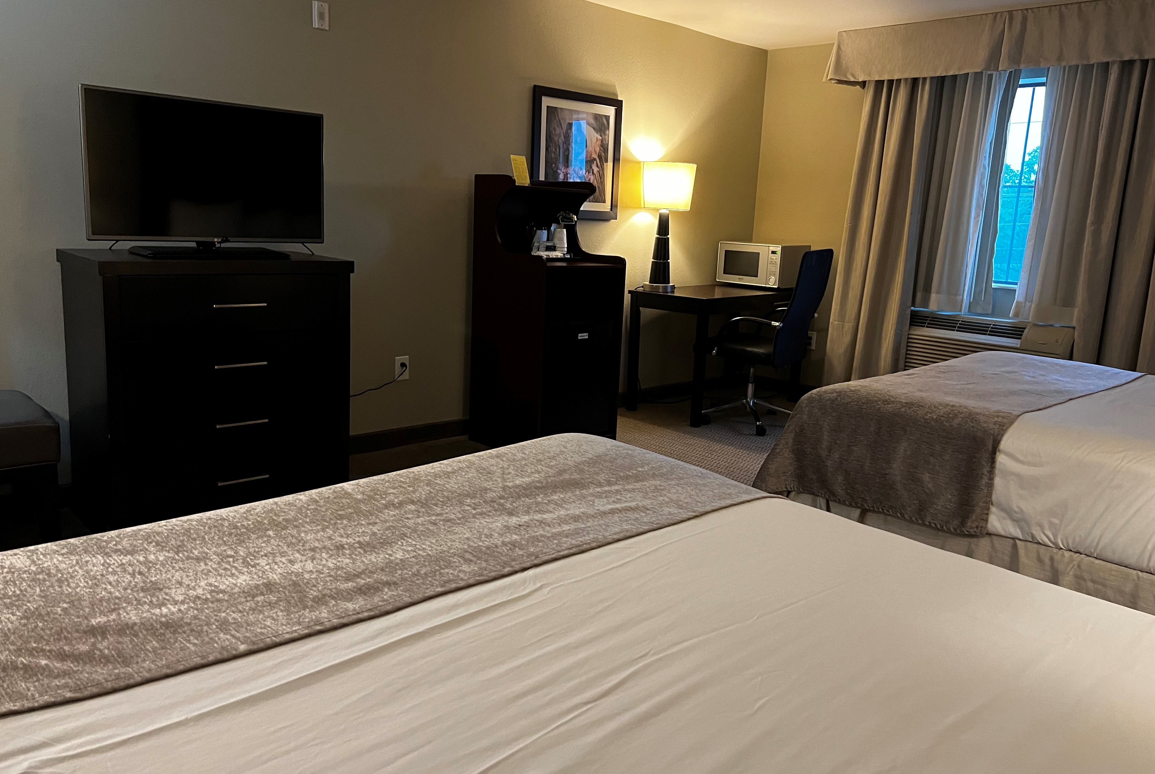 Guest room at the Baymont by Wyndham College Station in College Station, Texas