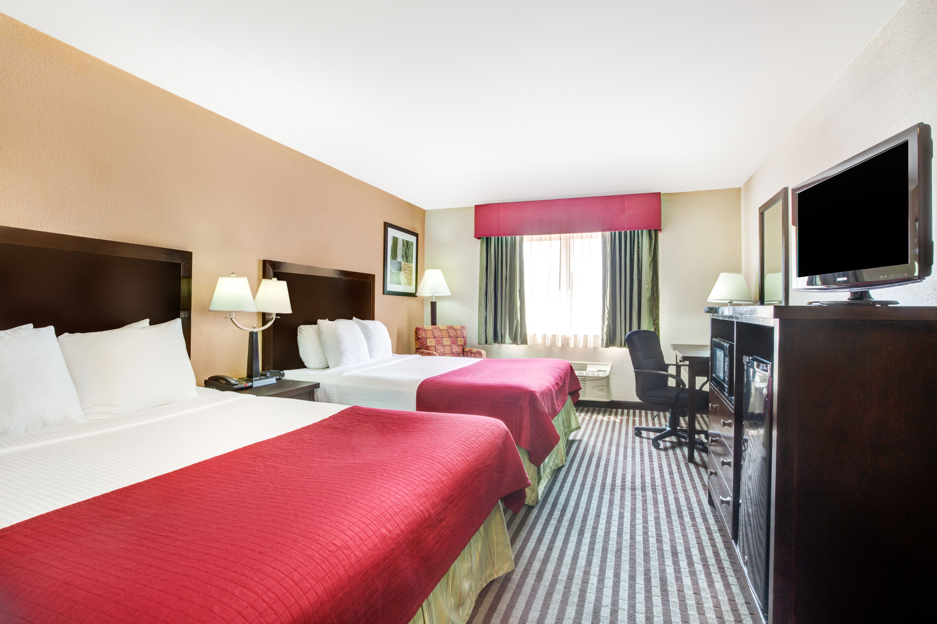 Guest room at the Baymont by Wyndham Dallas/ Love Field in Dallas, Texas