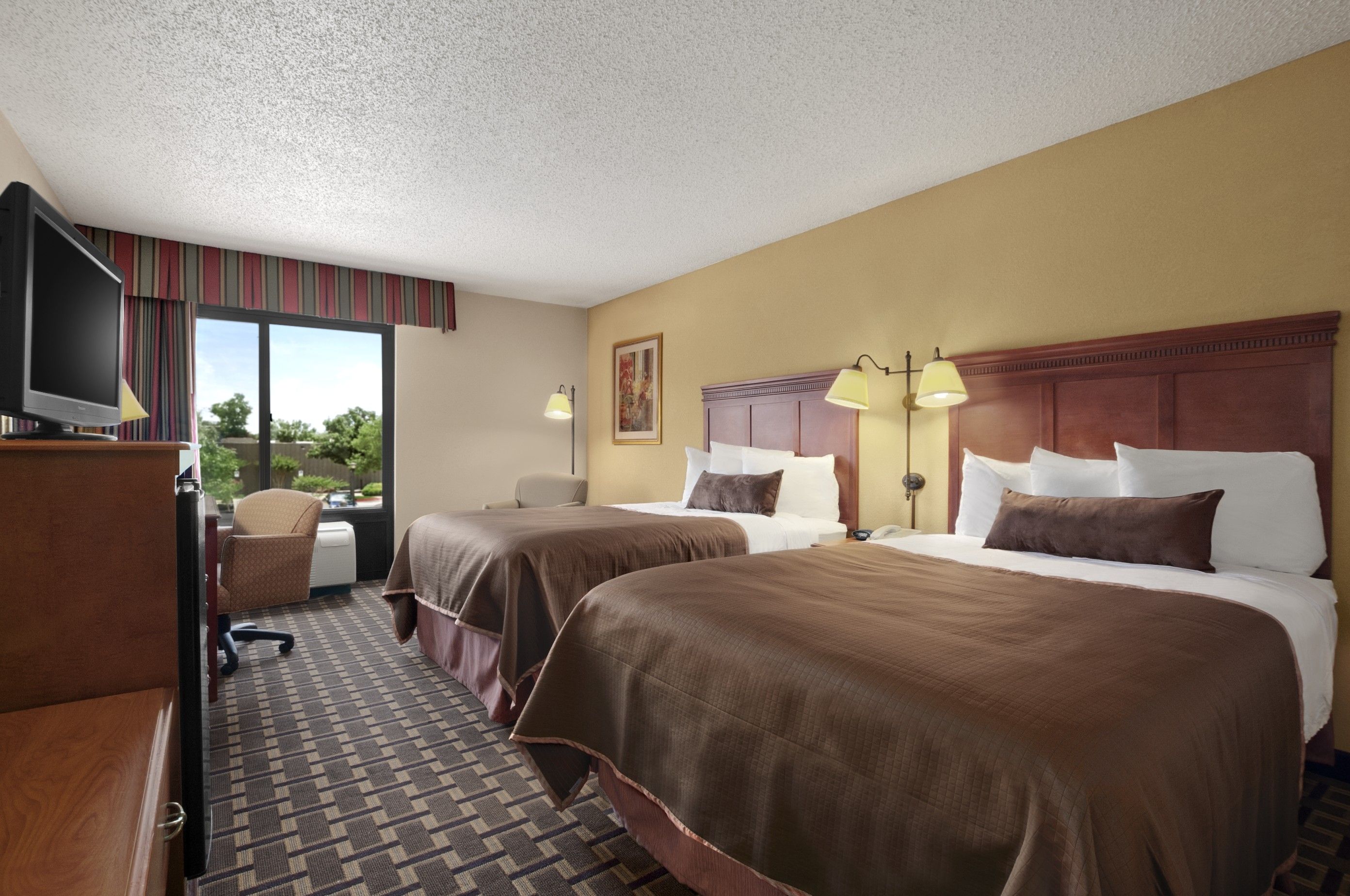 Guest room at the Baymont by Wyndham Lewisville in Lewisville, Texas