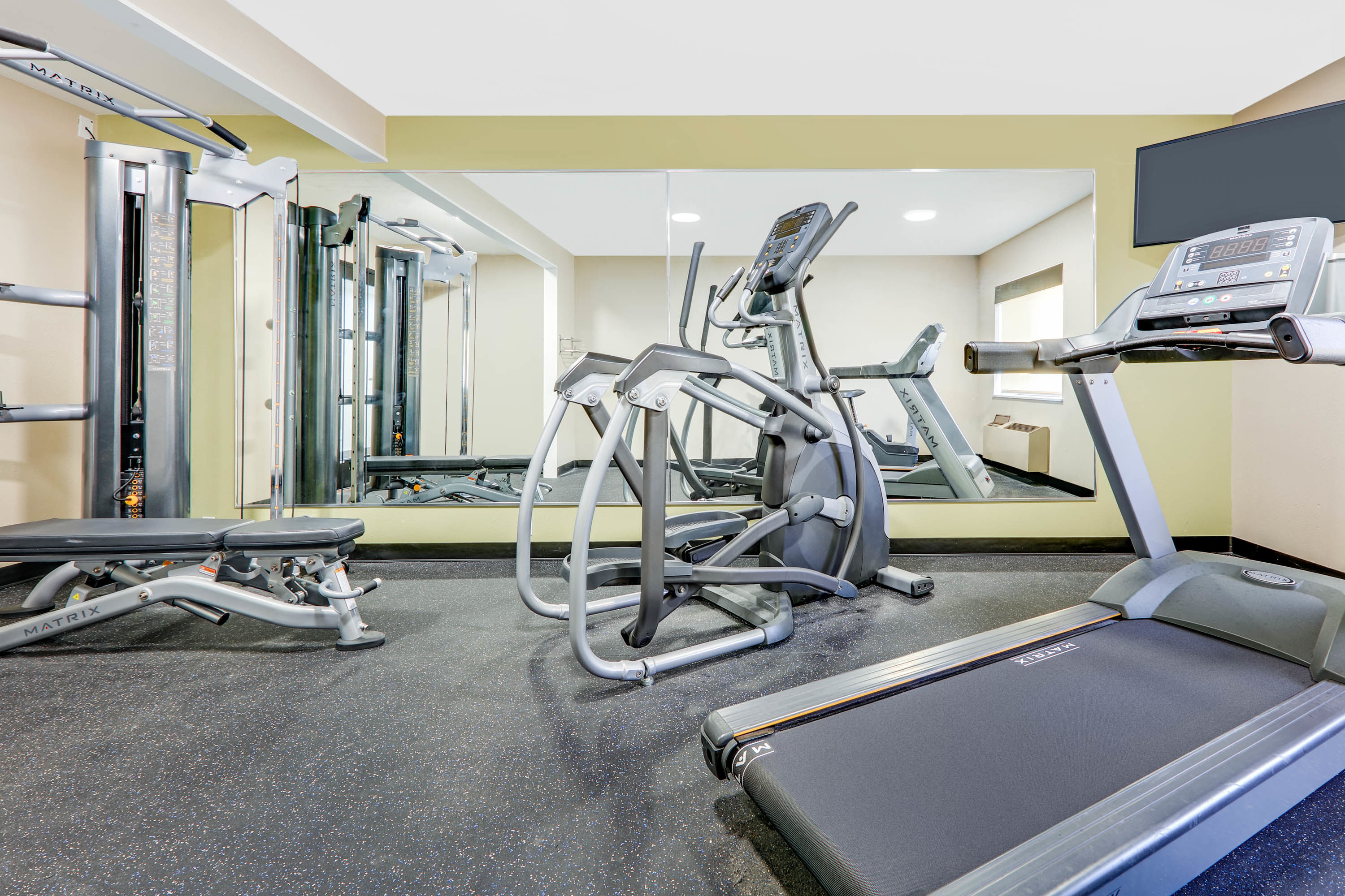 Fitness room at Baymont by Wyndham Plano in Plano, Texas