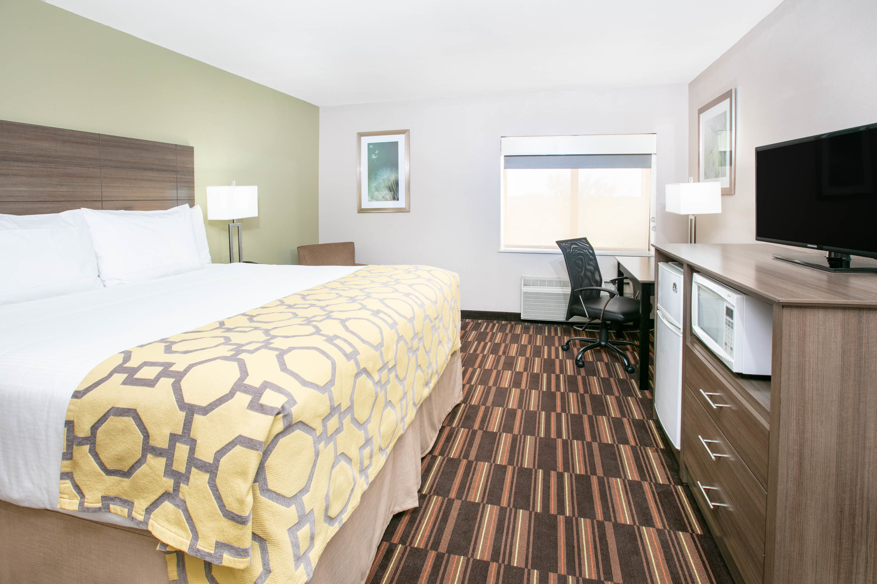 Guest room at the Baymont by Wyndham Plano in Plano, Texas