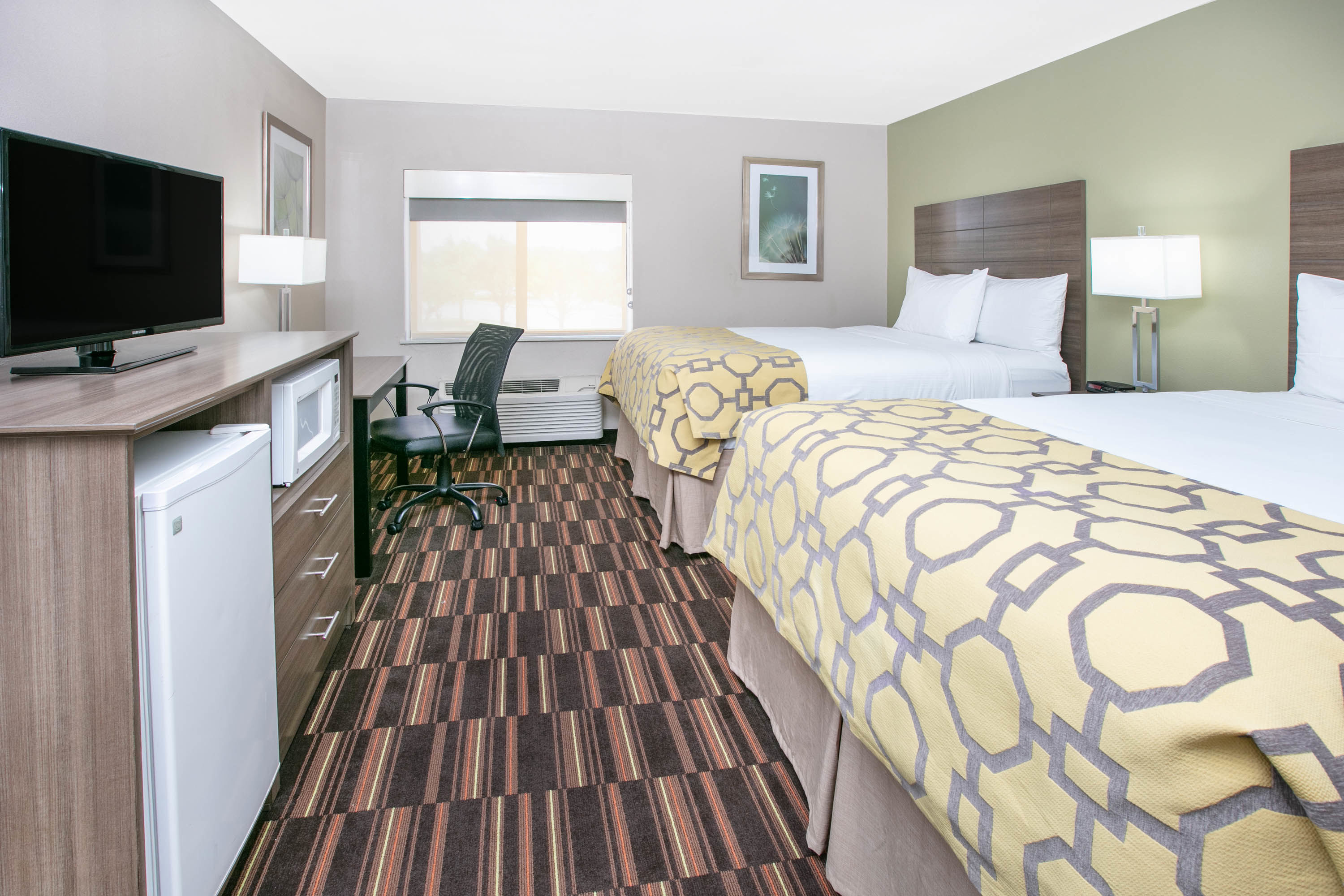 Guest room at the Baymont by Wyndham Plano in Plano, Texas