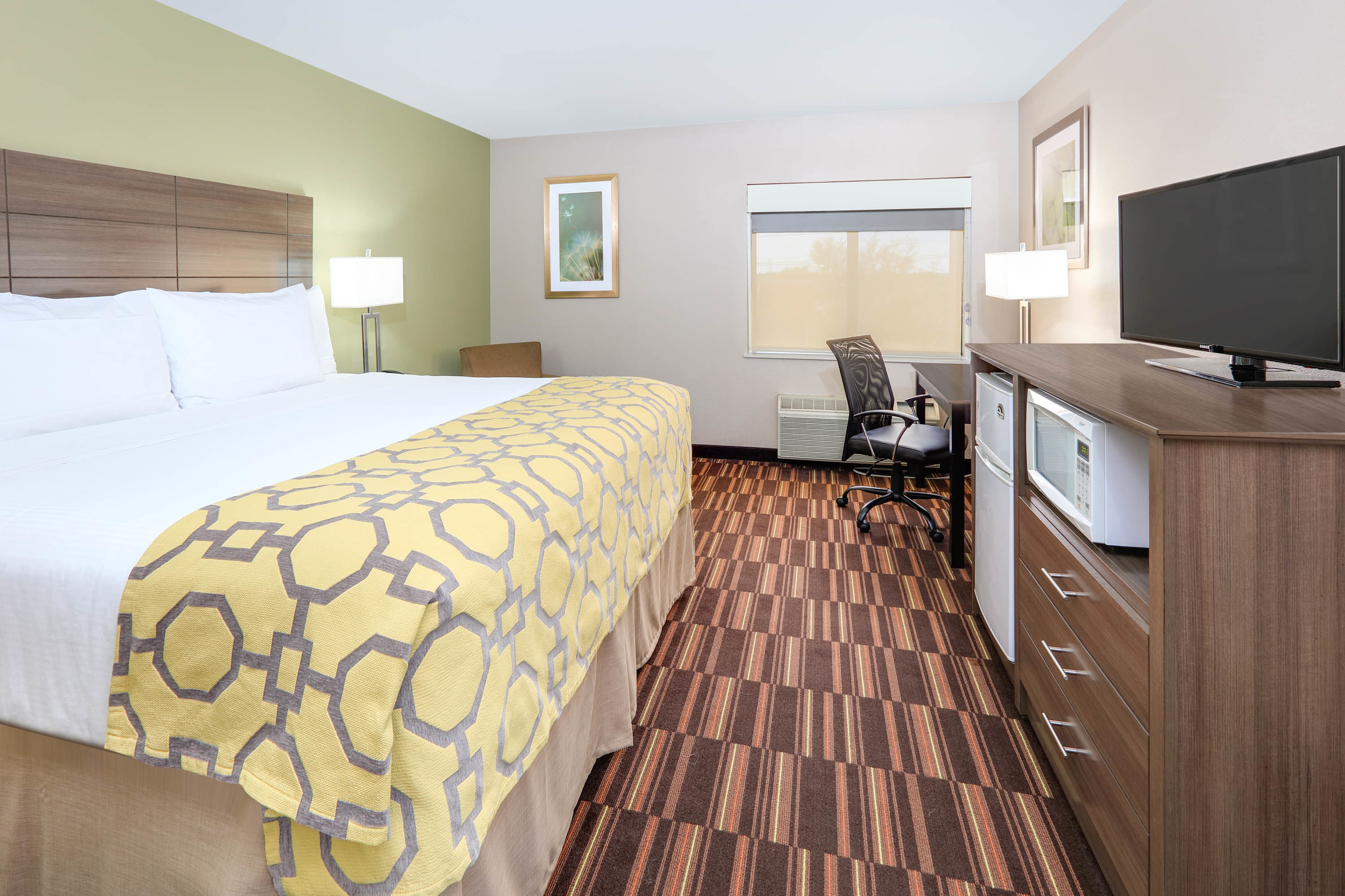 Guest room at the Baymont by Wyndham Plano in Plano, Texas