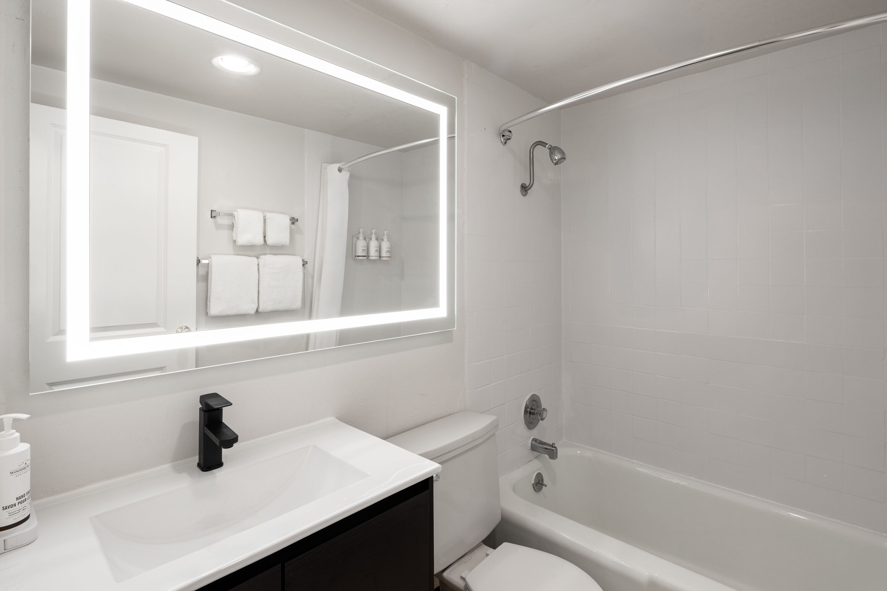 Guest room bath at the The Dylan, a Baymont by Wyndham in Seattle, Washington