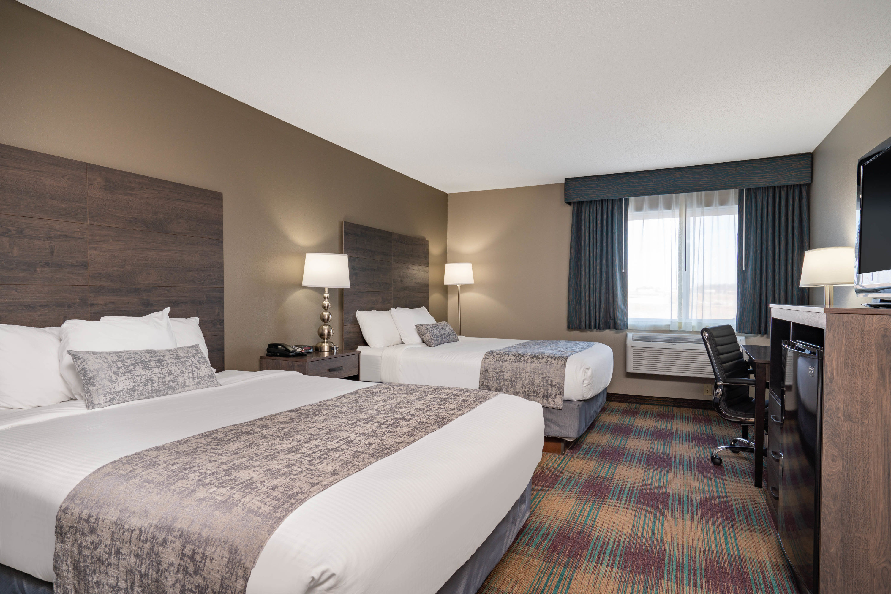 Guest room at the Baymont by Wyndham Baldwin in Baldwin, Wisconsin