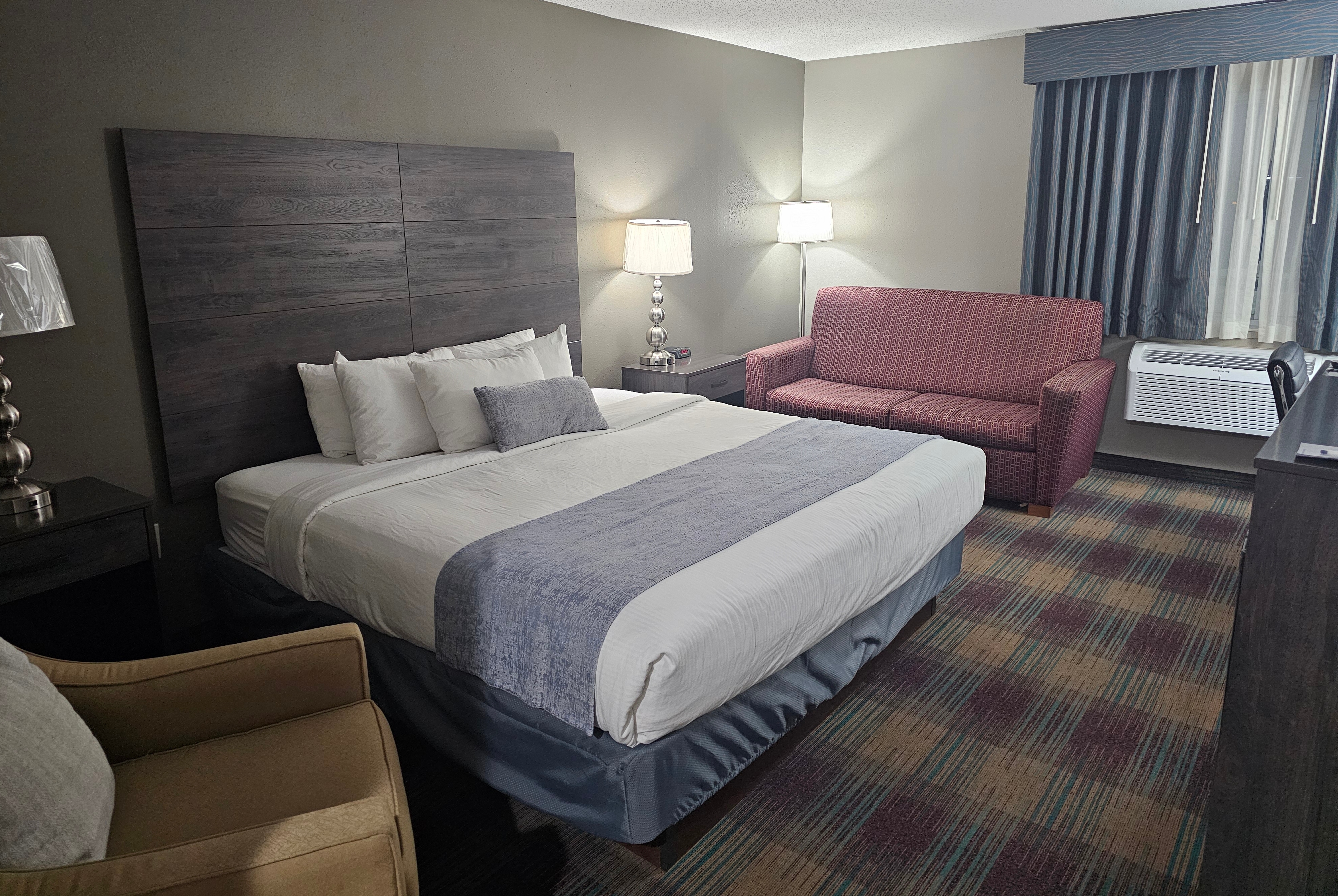 King bed guest room at the Baymont by Wyndham Baldwin in Baldwin, Wisconsin