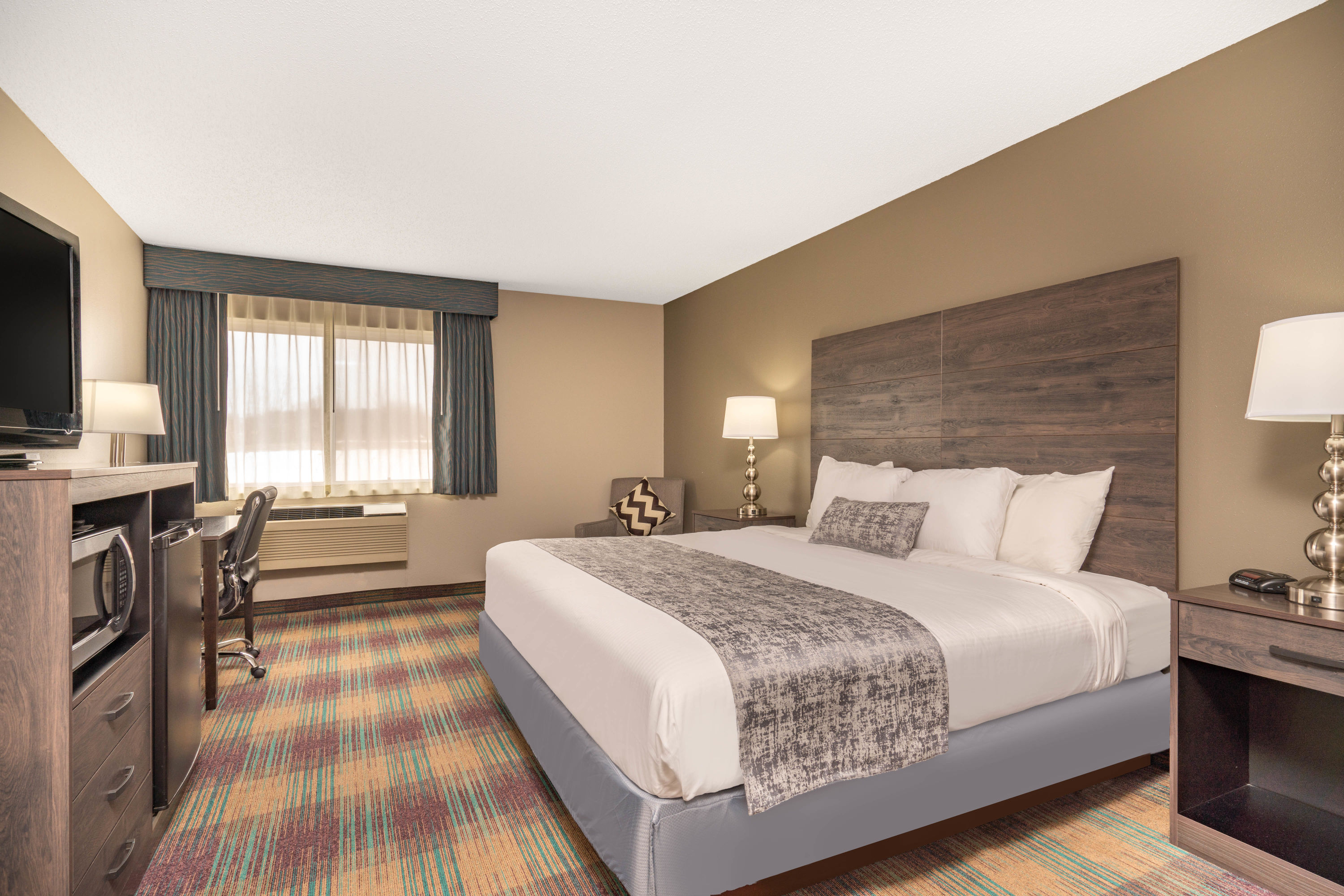 Guest room at the Baymont by Wyndham Baldwin in Baldwin, Wisconsin