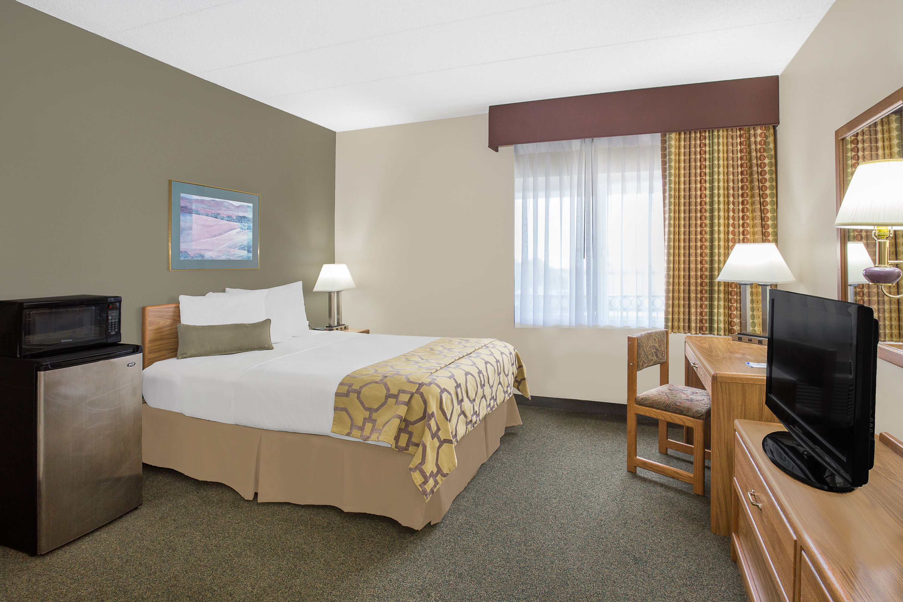 Guest room at the Baymont by Wyndham Janesville in Janesville, Wisconsin