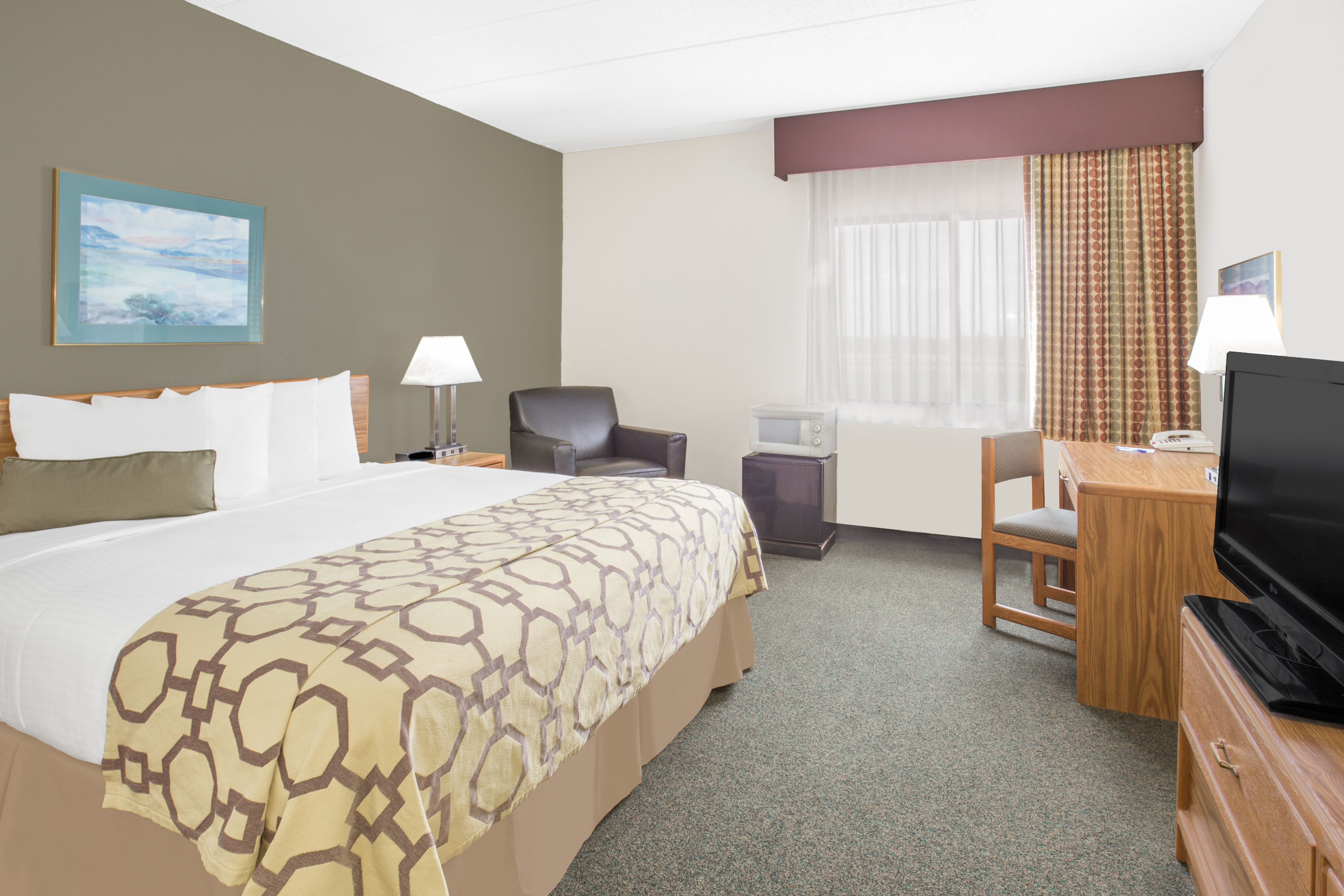 Guest room at the Baymont by Wyndham Janesville in Janesville, Wisconsin