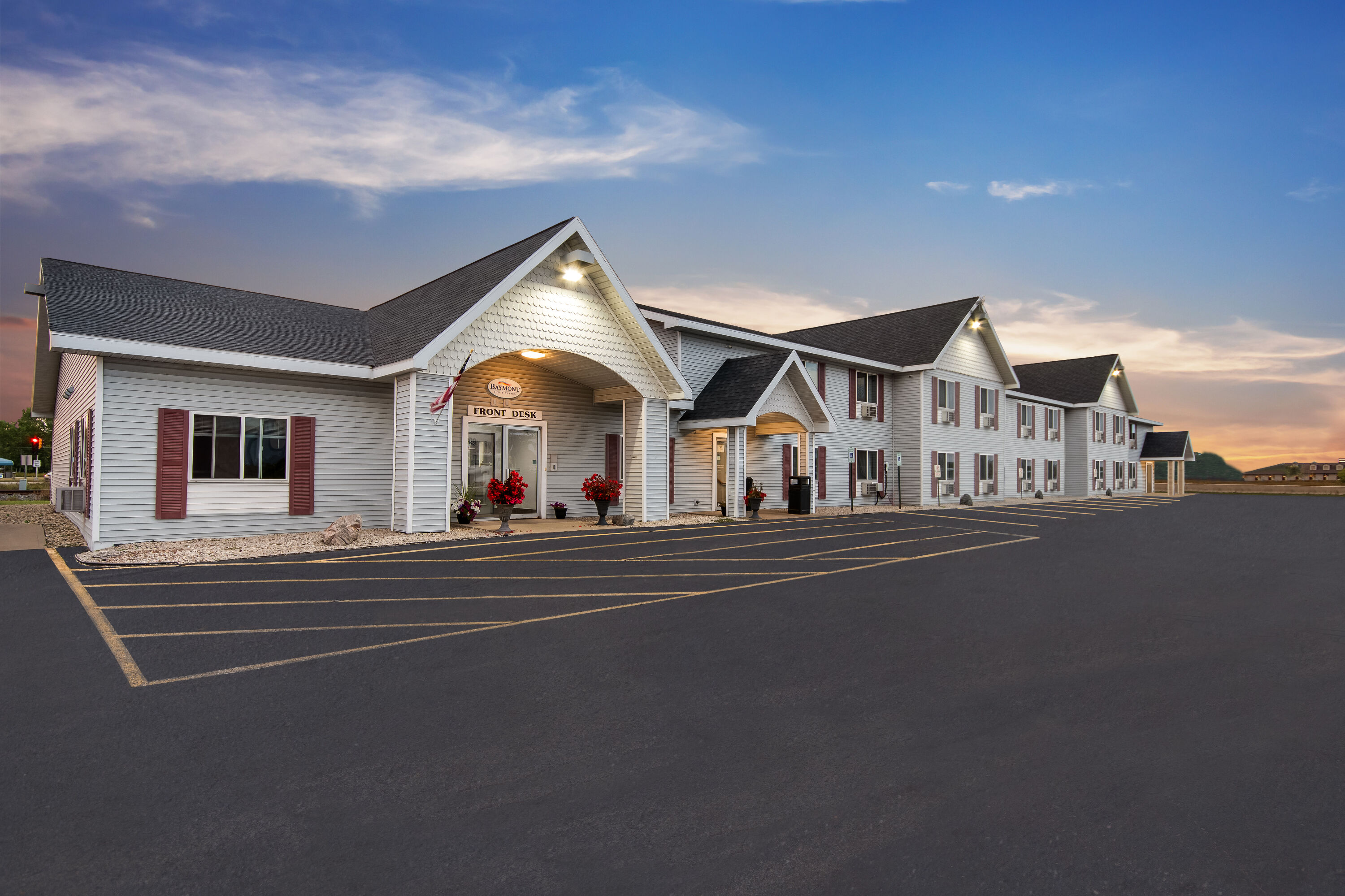 Exterior Dusk Image of Baymont by Wyndham Marinette hotel in Marinette, Wisconsin