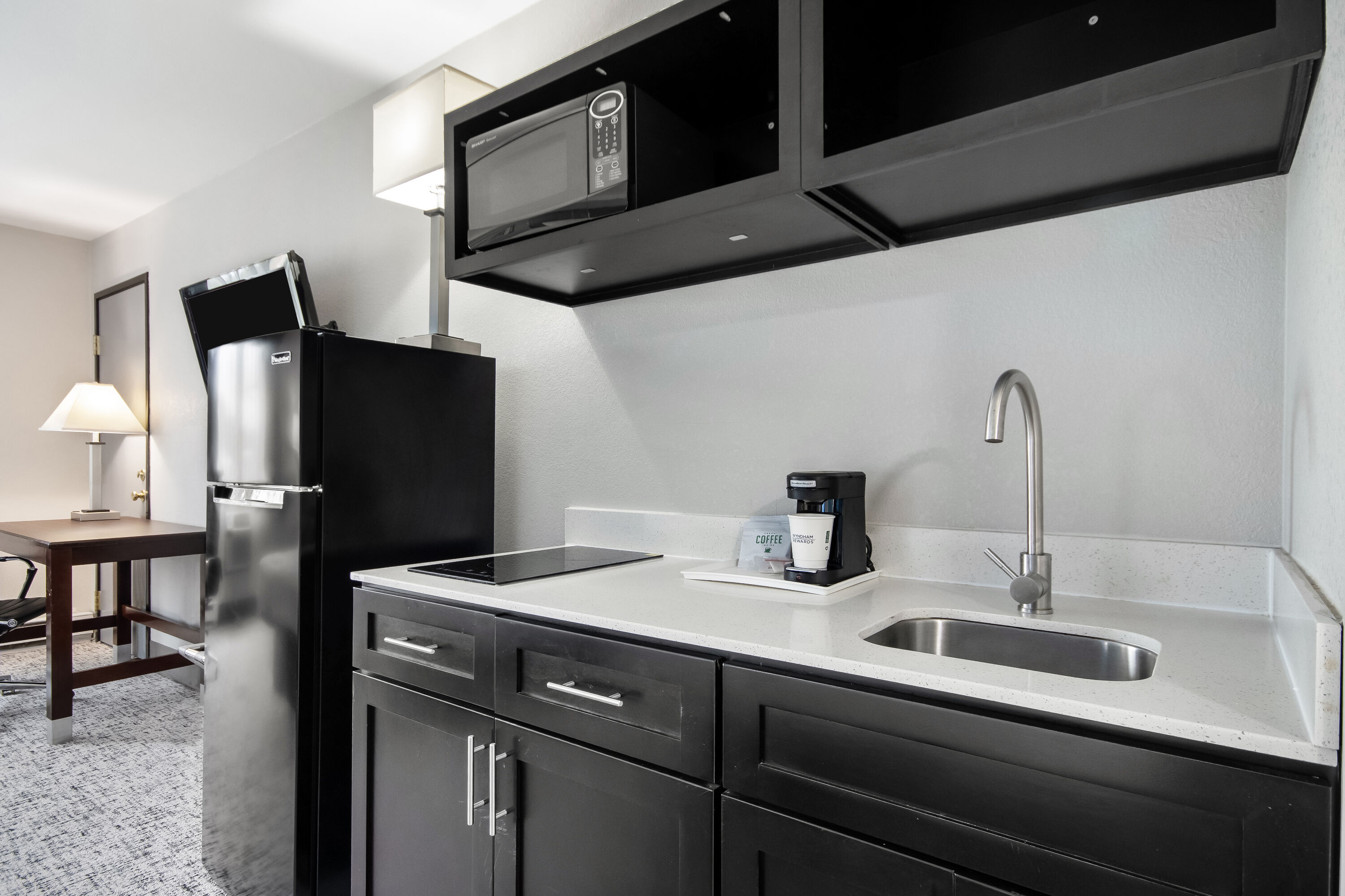 King bed guest room at the Baymont by Wyndham Marinette in Marinette, Wisconsin