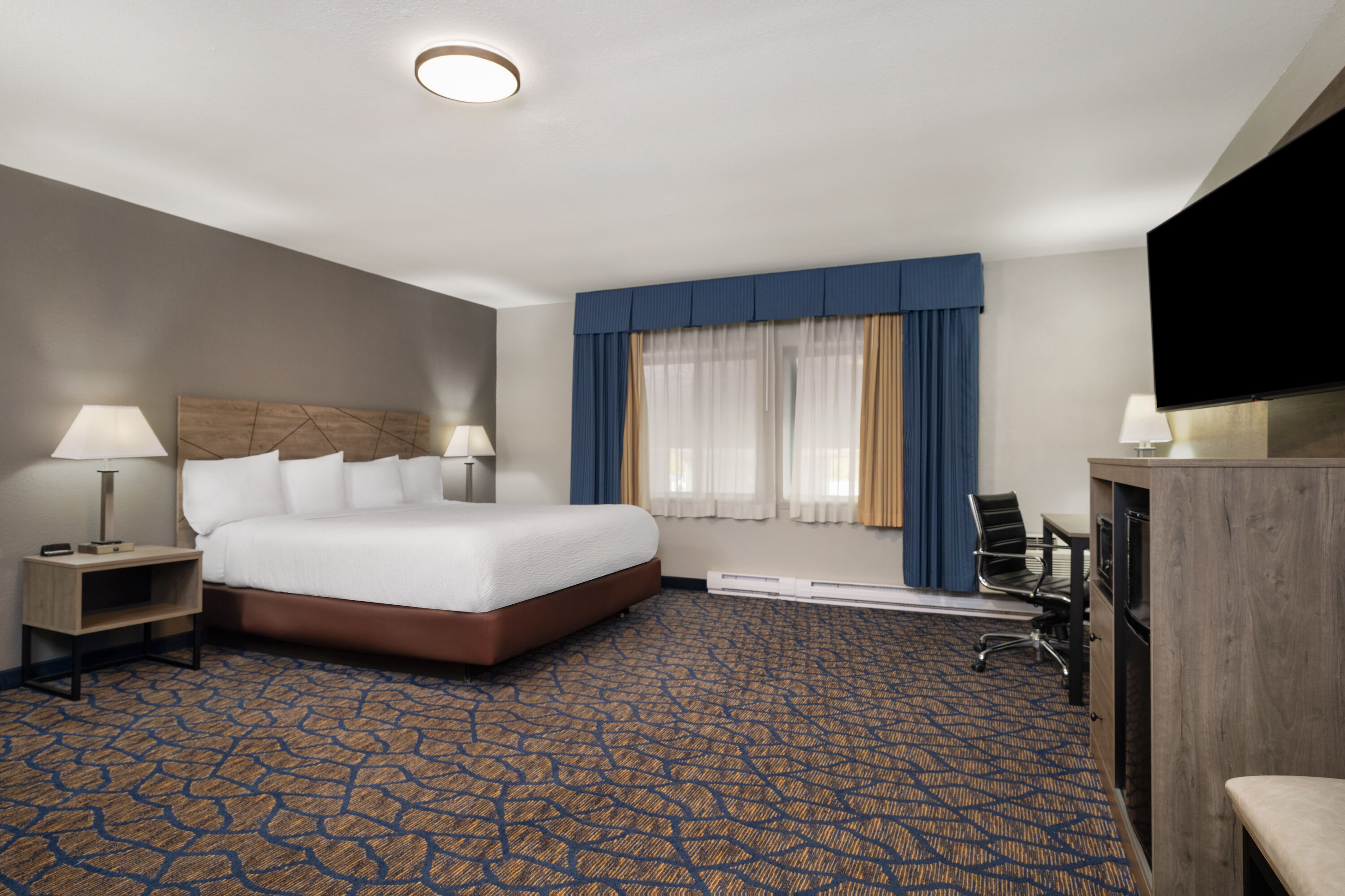 Guest room at the Baymont by Wyndham Waukesha in Waukesha, Wisconsin