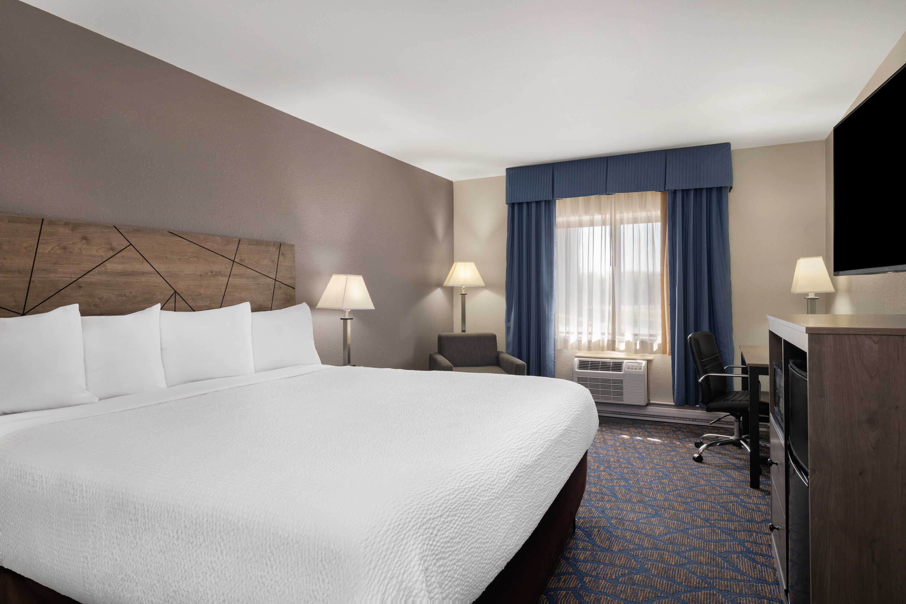 Guest room at the Baymont by Wyndham Waukesha in Waukesha, Wisconsin