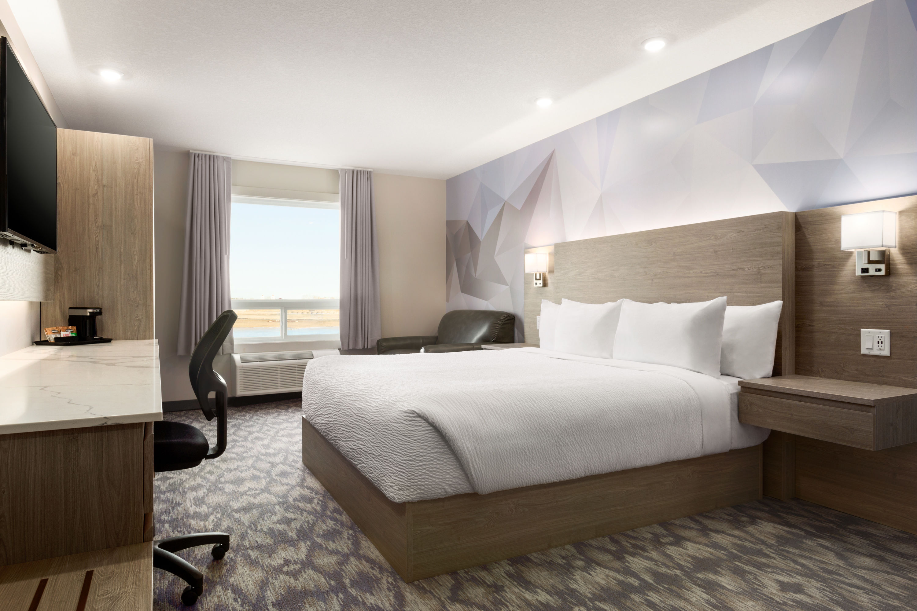 King bed guest room at the Days Inn by Wyndham Calgary North Balzac in Balzac, Alberta