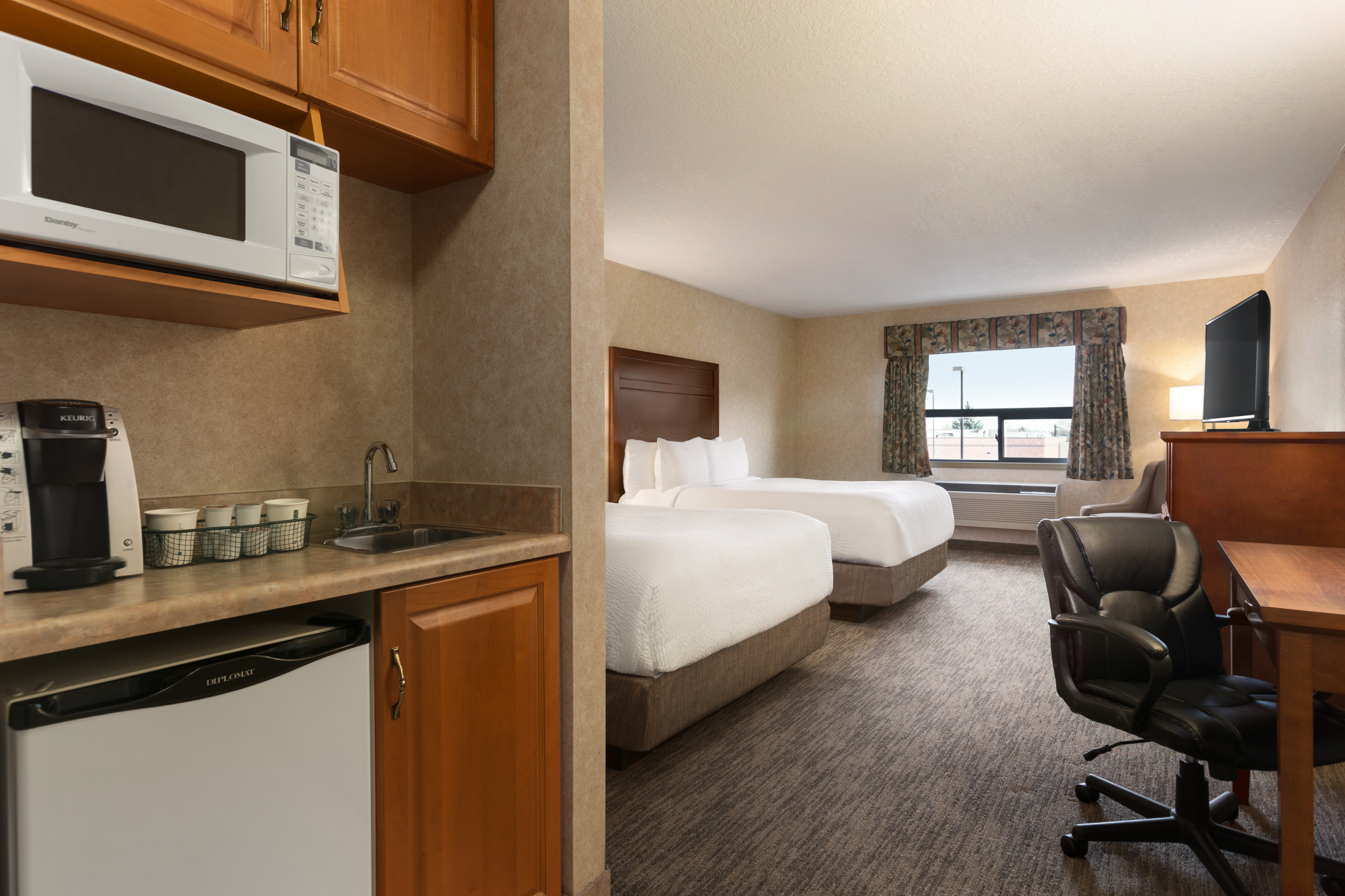Guest room at the Days Inn & Suites by Wyndham Brooks in Brooks, Alberta