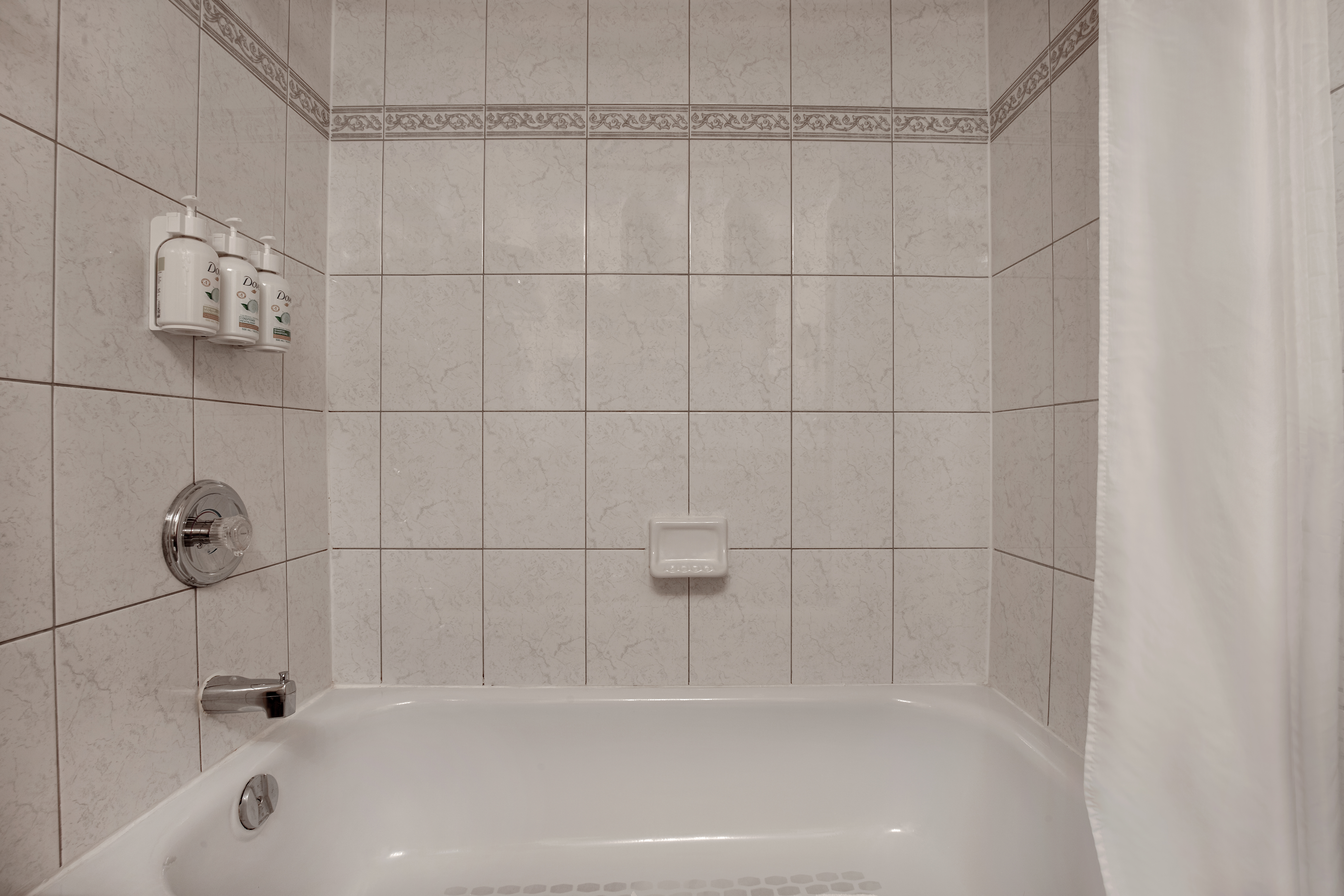 Guest room bath at the Days Inn by Wyndham Calgary South in Calgary, Alberta
