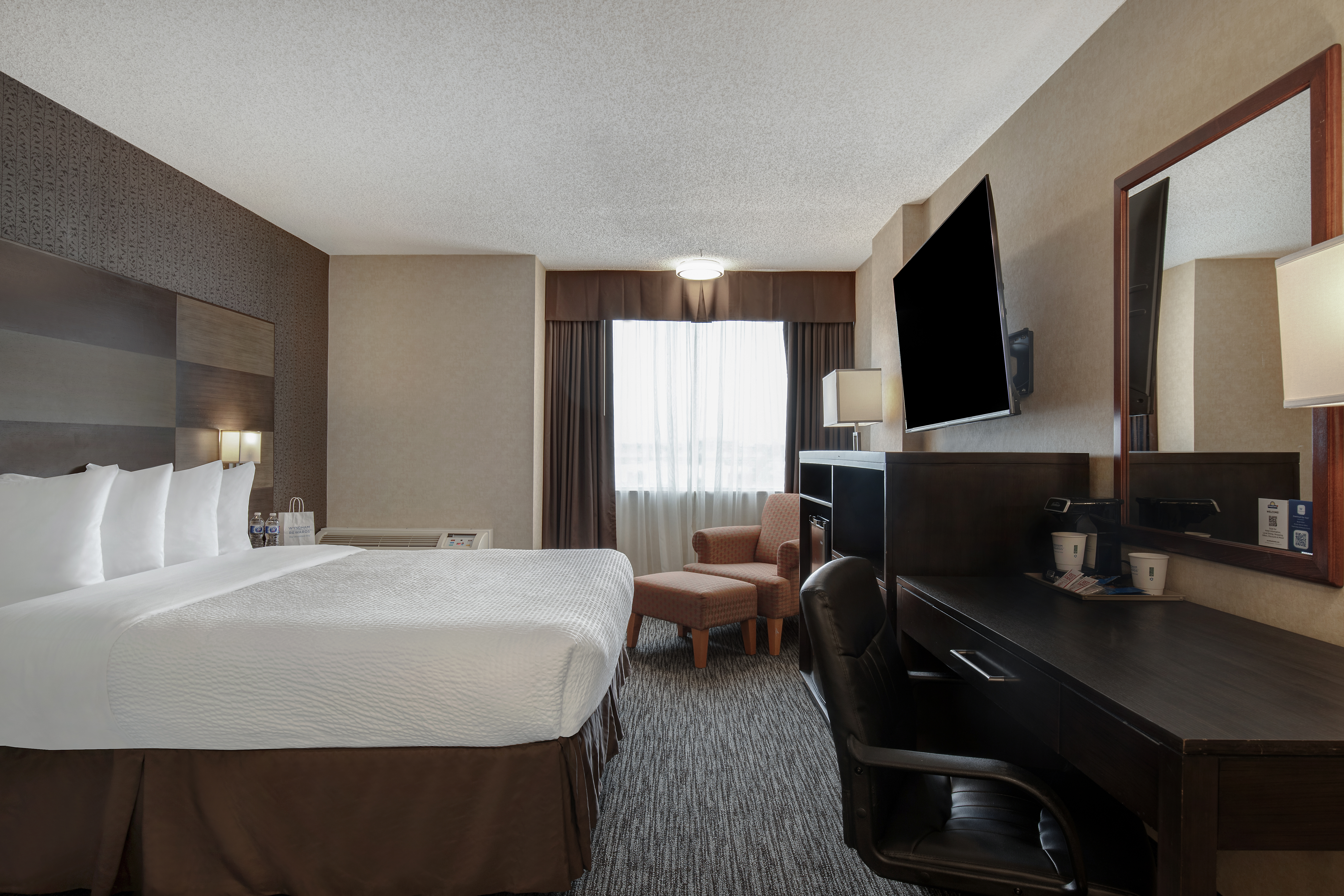 Guest room at the Days Inn by Wyndham Calgary South in Calgary, Alberta