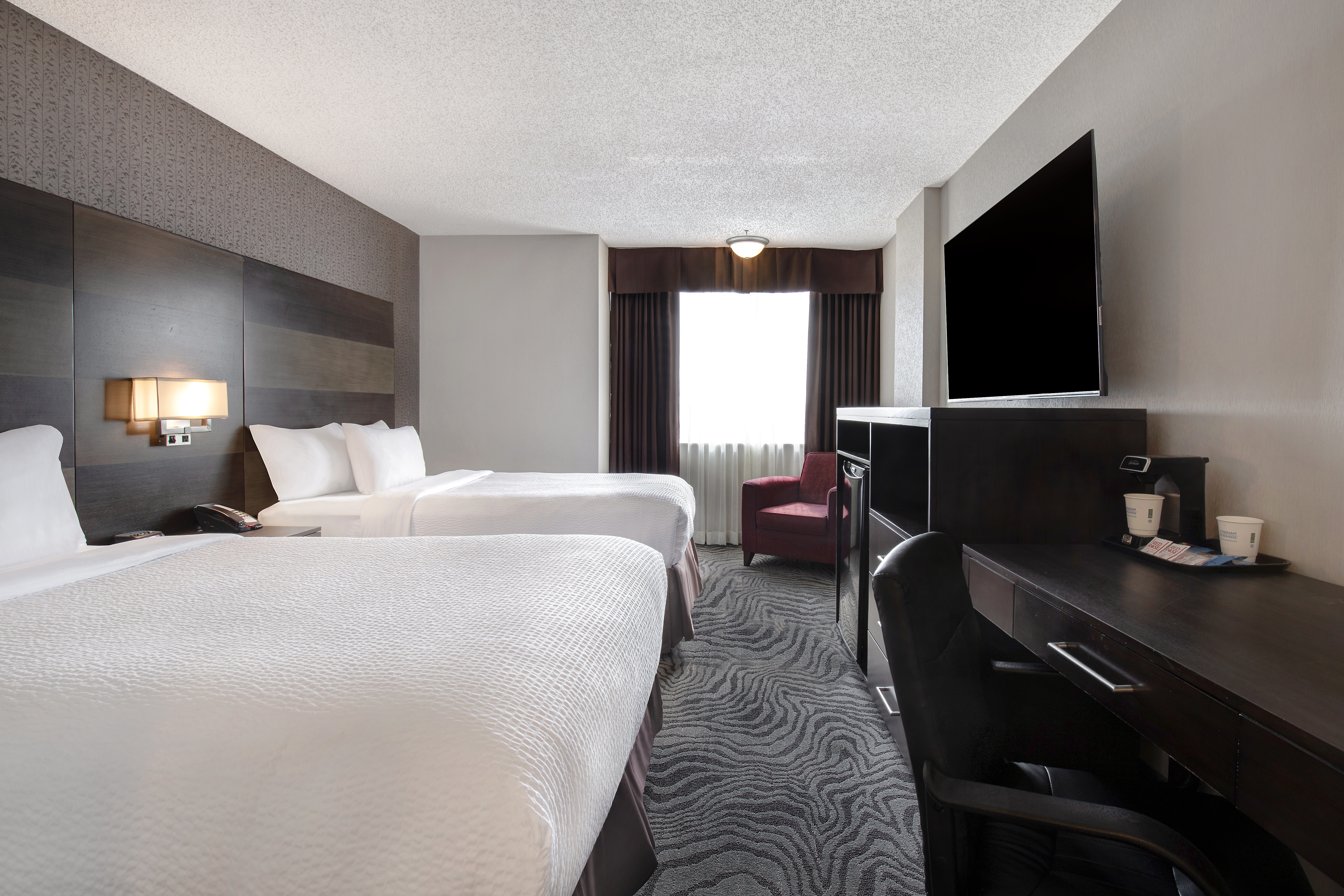 Guest room at the Days Inn by Wyndham Calgary South in Calgary, Alberta